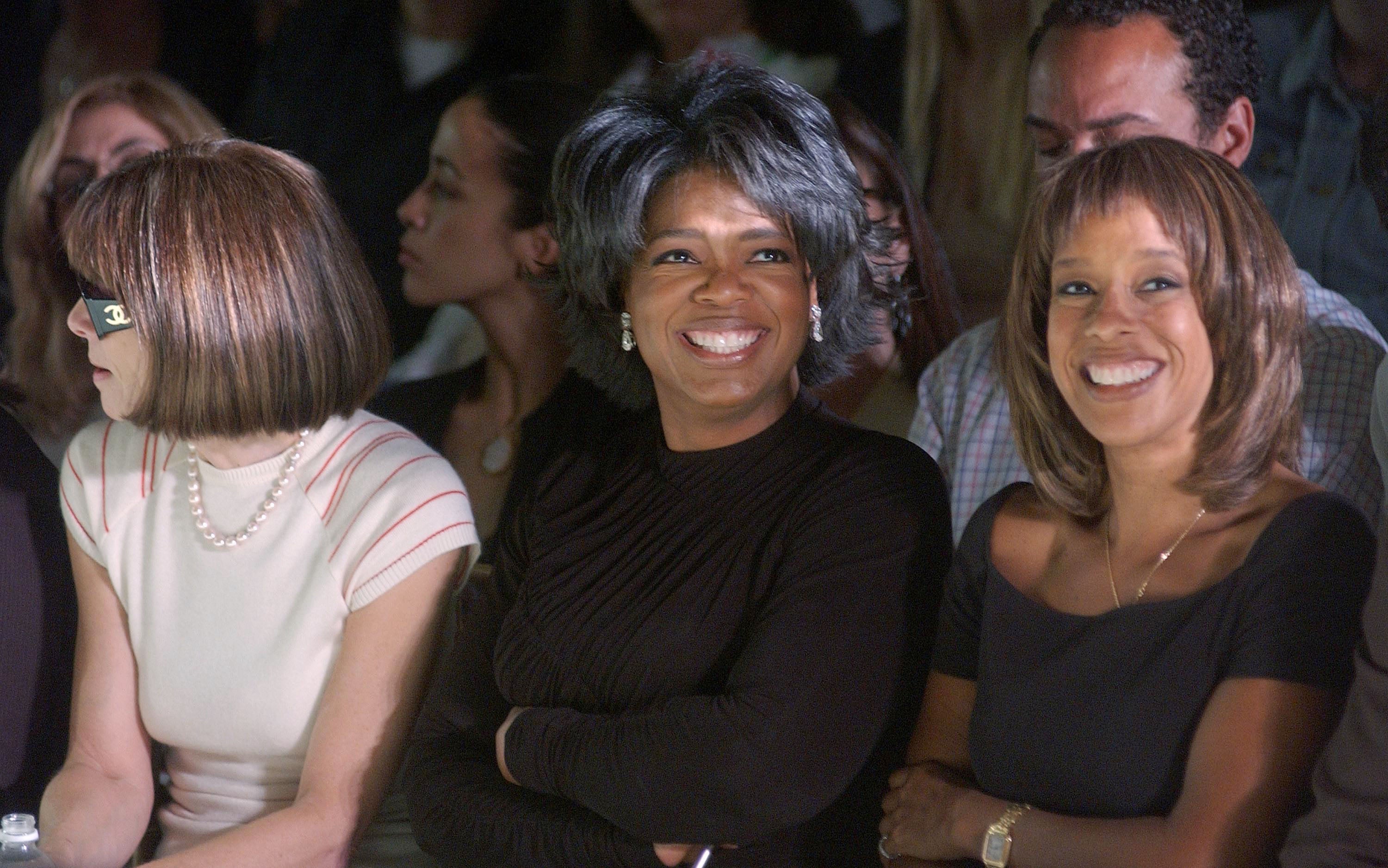 Talk show host Oprah Winfrey (C), Vogue editor Anna Wintour (L) and Oprah Magazine editor Gayle King attend the Vera Wang Spring/Summer 2003 Collection at the New York Public Library for Mercedes-Benz Fashion Week September 20, 2002