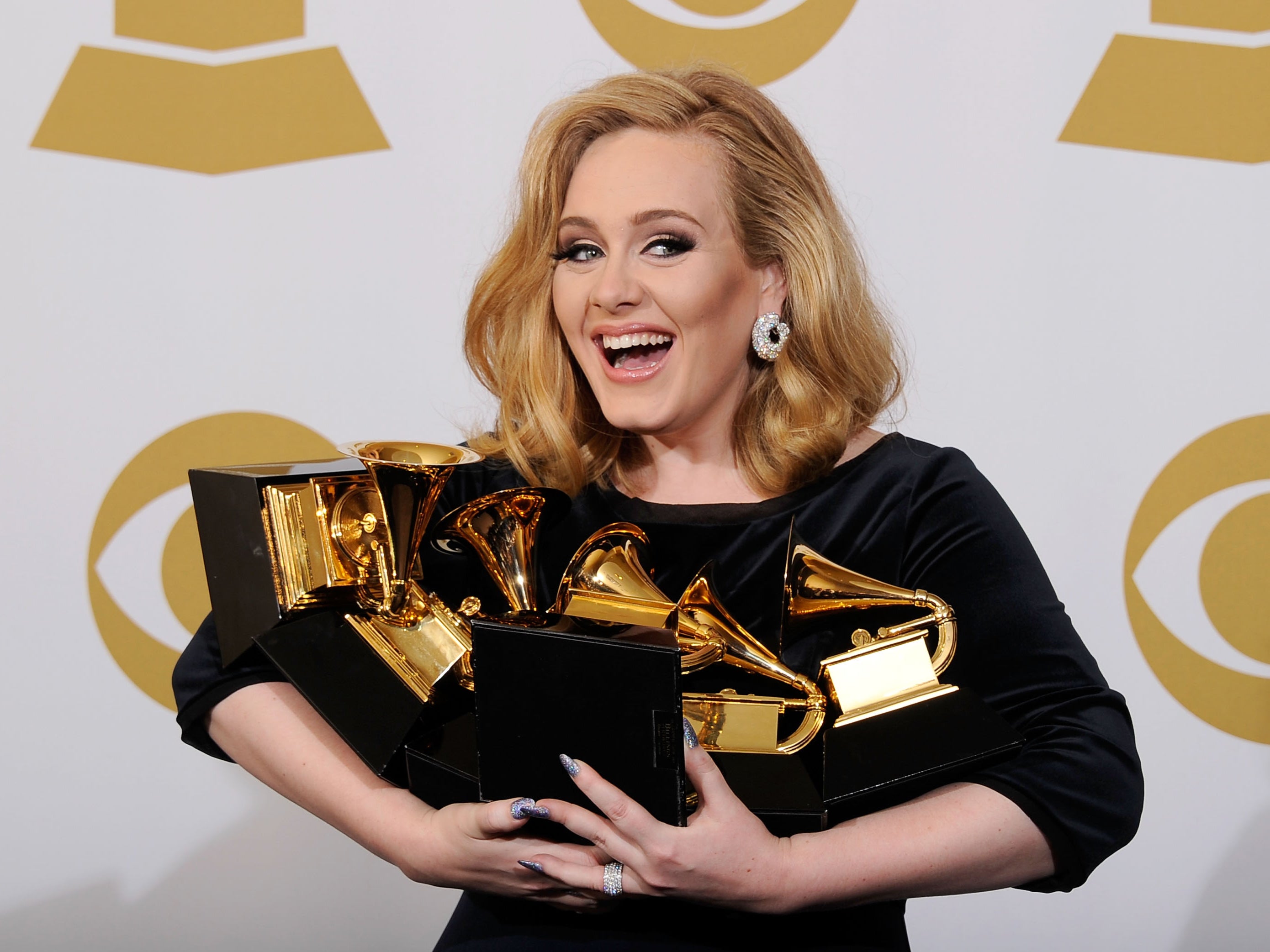 Adele with her Grammys at the 2012 awards