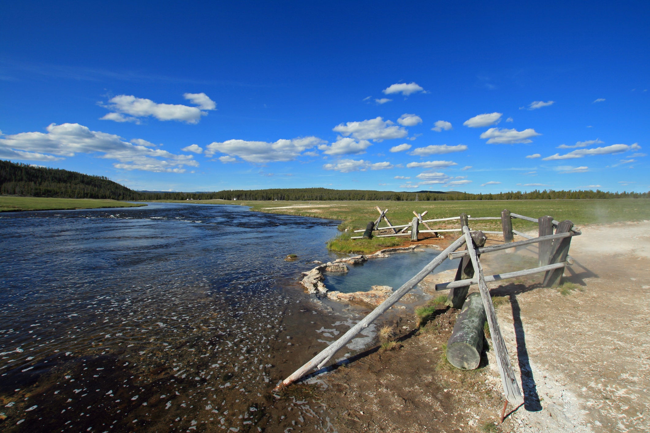 Maidens Grave Hot Spring flowing into the Firehole River in Yellowstone National Park in Wyoming,United States