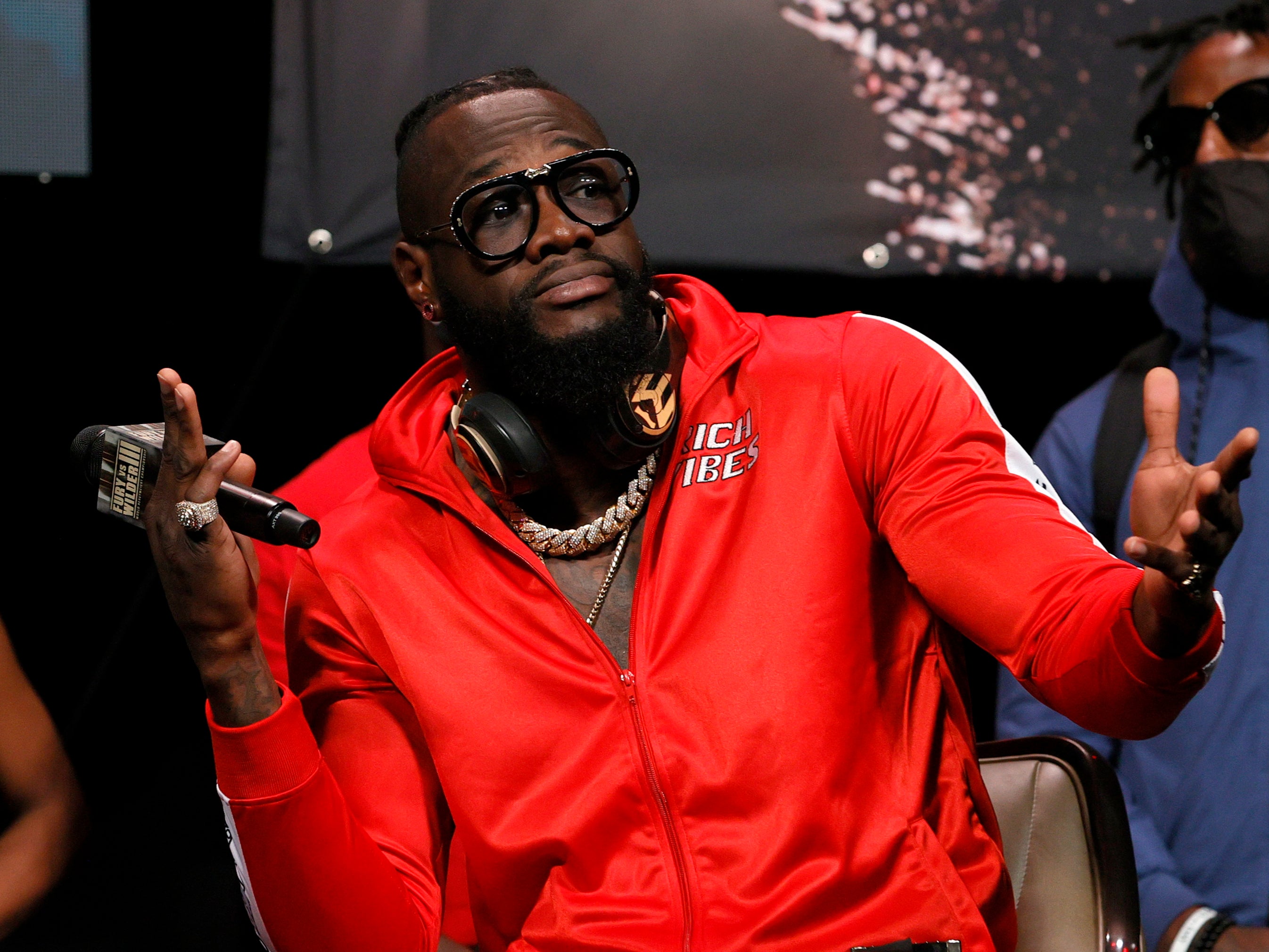 Deontay Wilder gestures during a news conference at MGM Grand Garden Arena