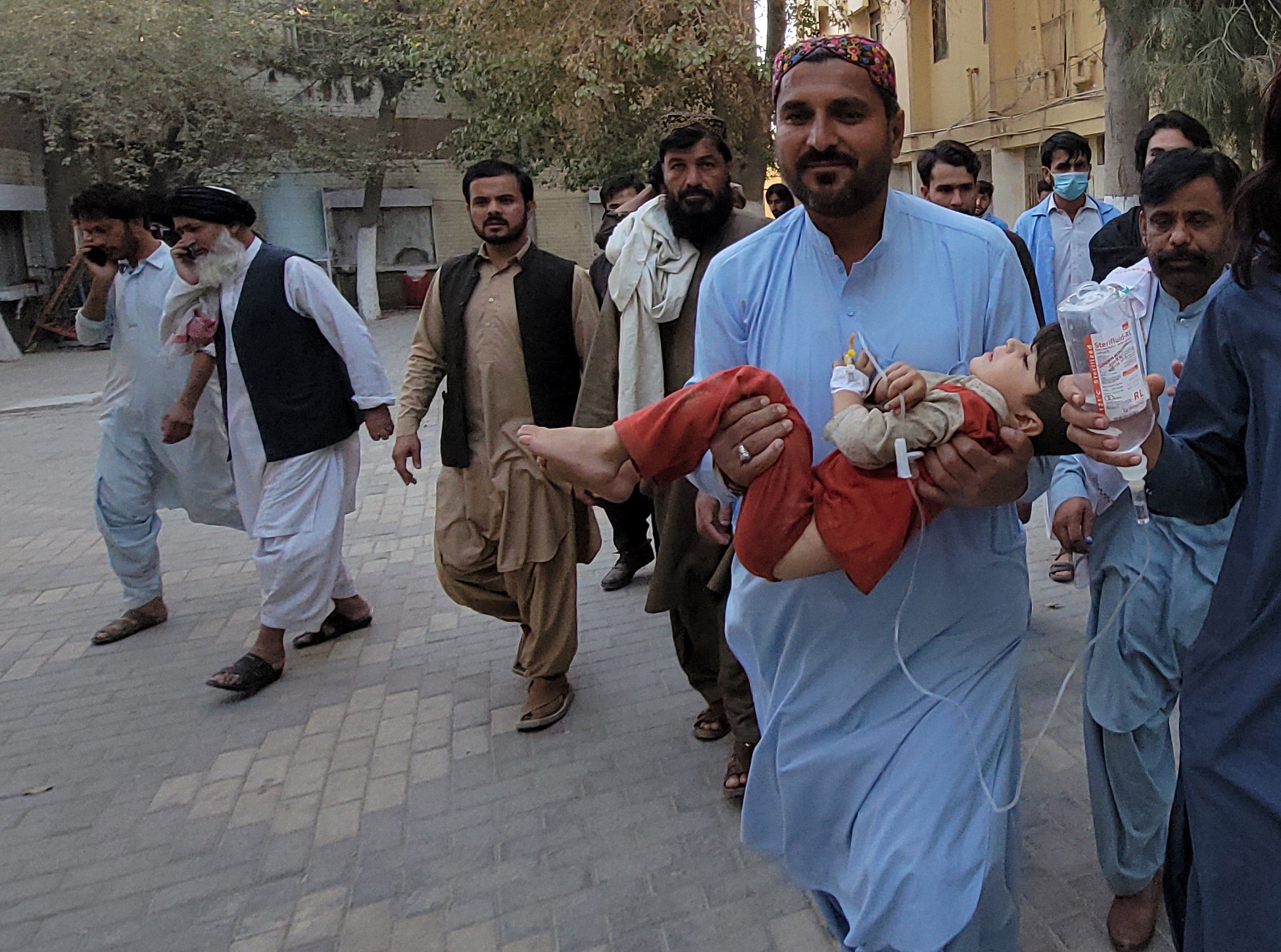 A victim of the earthquake is carried to a hospital in Quetta, Balochistan province, Pakistan