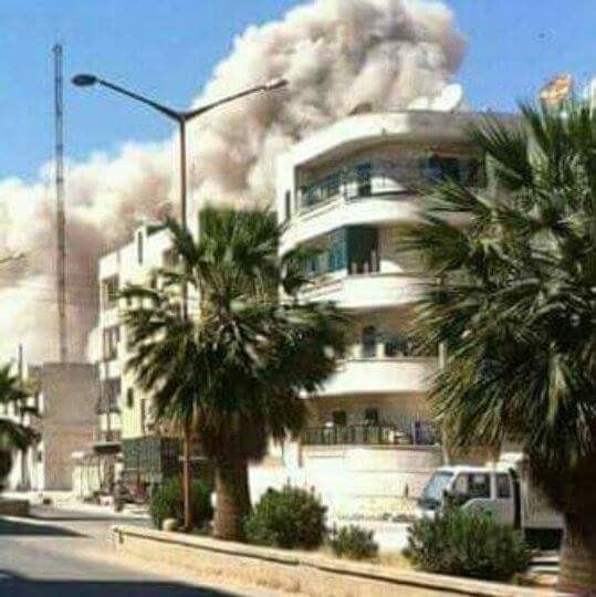 Manal and Bilal’s apartment block in the seconds after a neighbouring complex was destroyed by a government shell