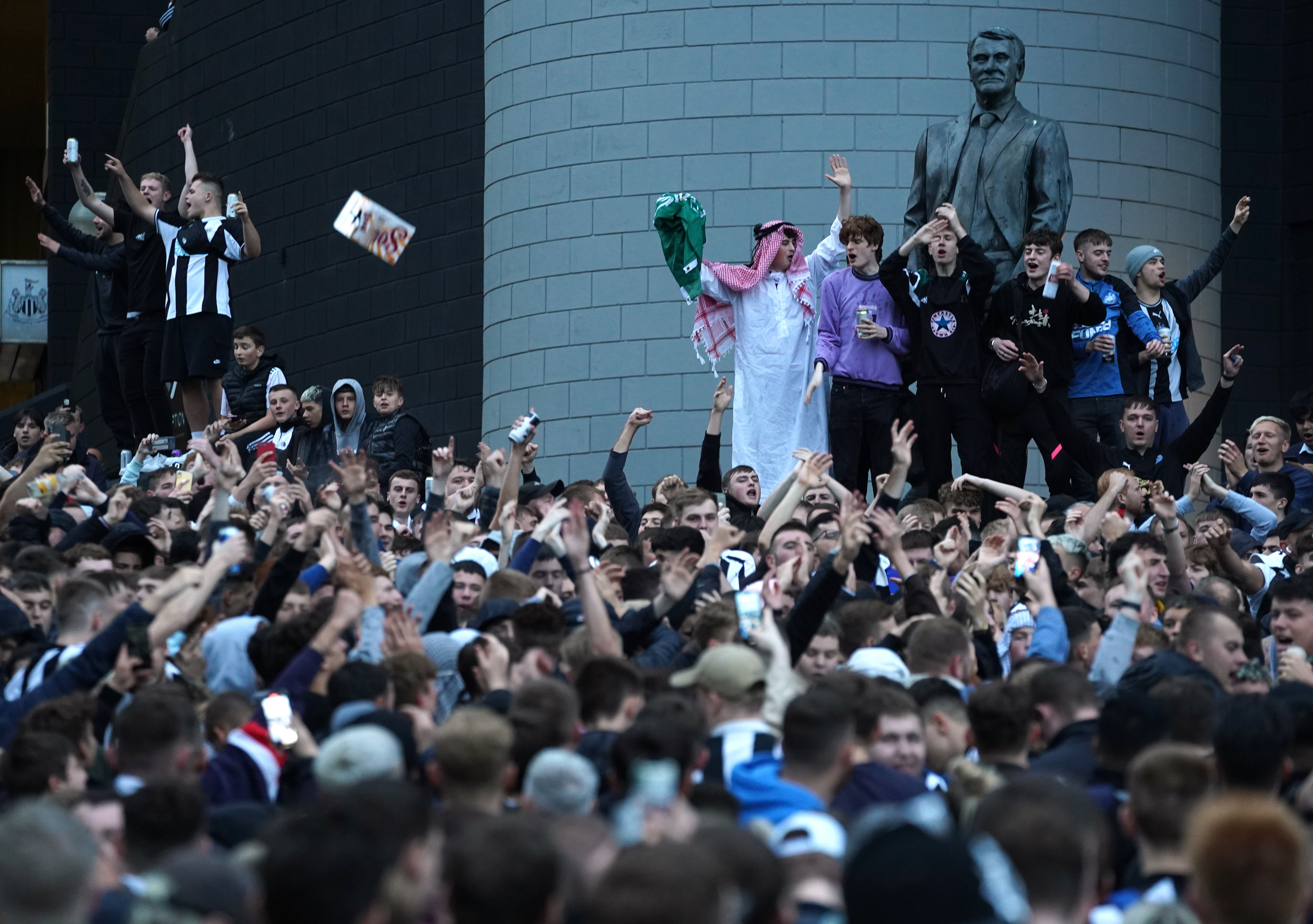 Newcastle United supporters surrounded the statue of the late Sir Bobby Robson