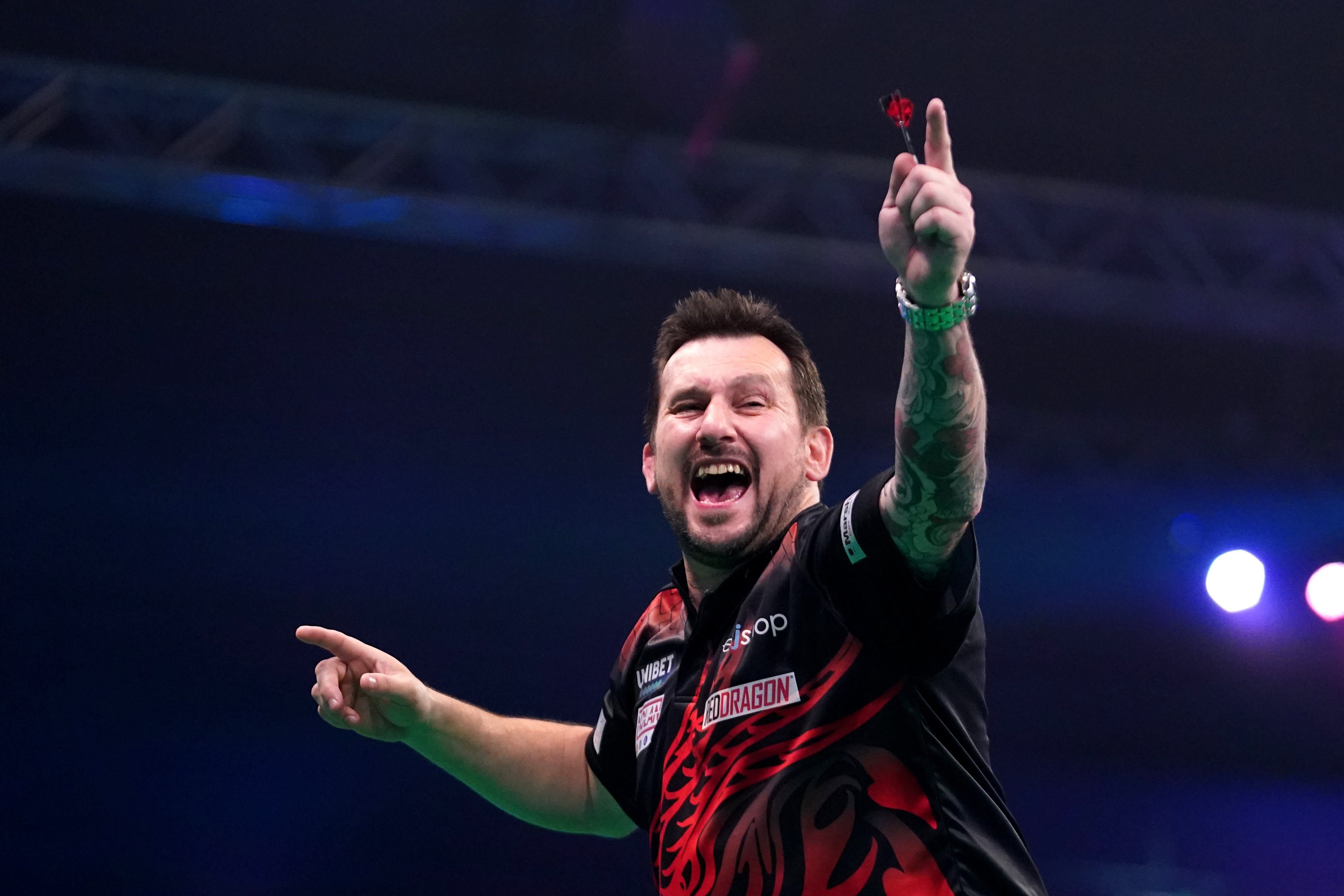 Jonny Clayton celebrates after winning the Premier League final (PA)