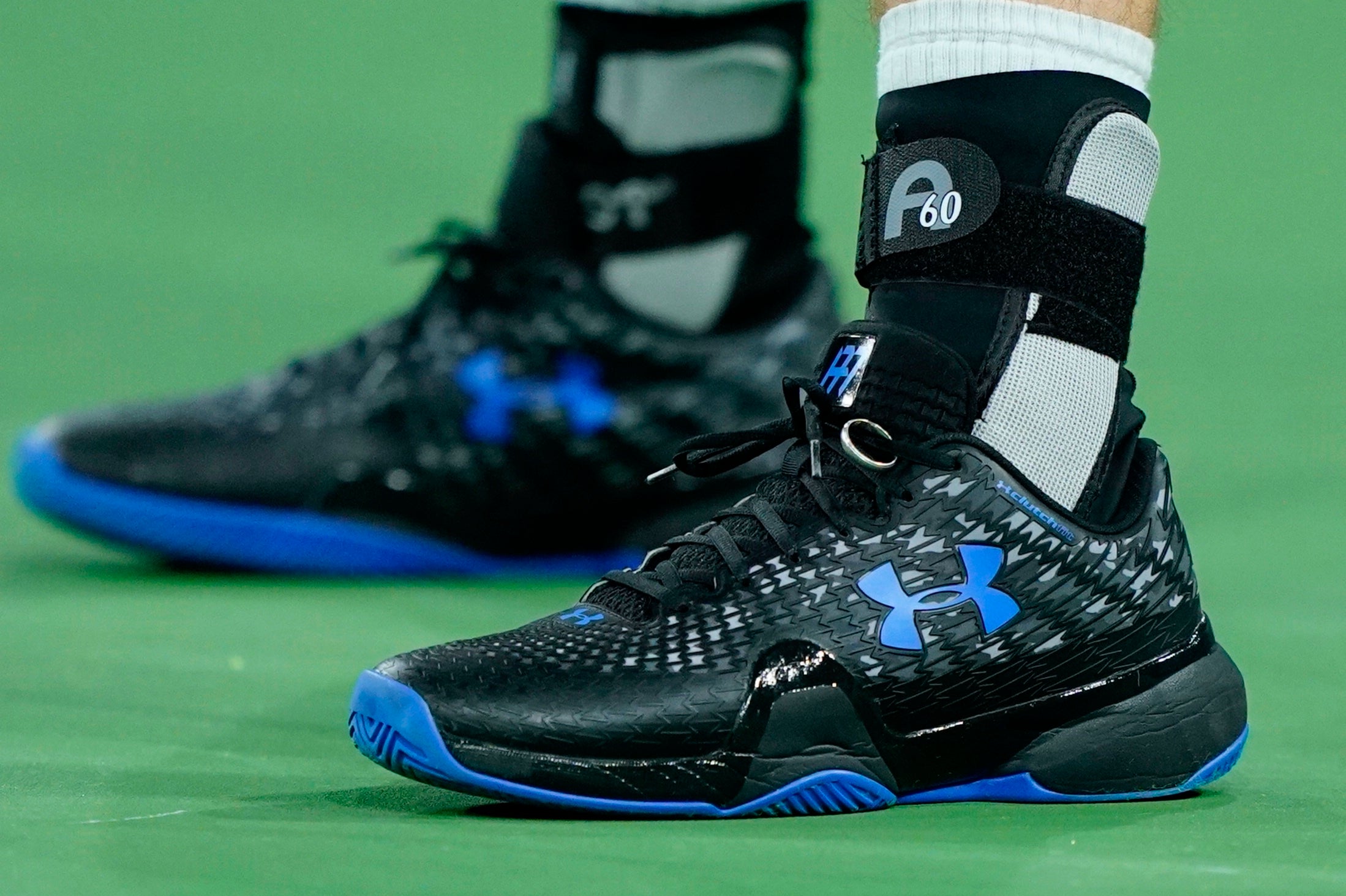 Andy Murray’s wedding ring was safely back tied to his shoes (Mark J Terrill/AP)