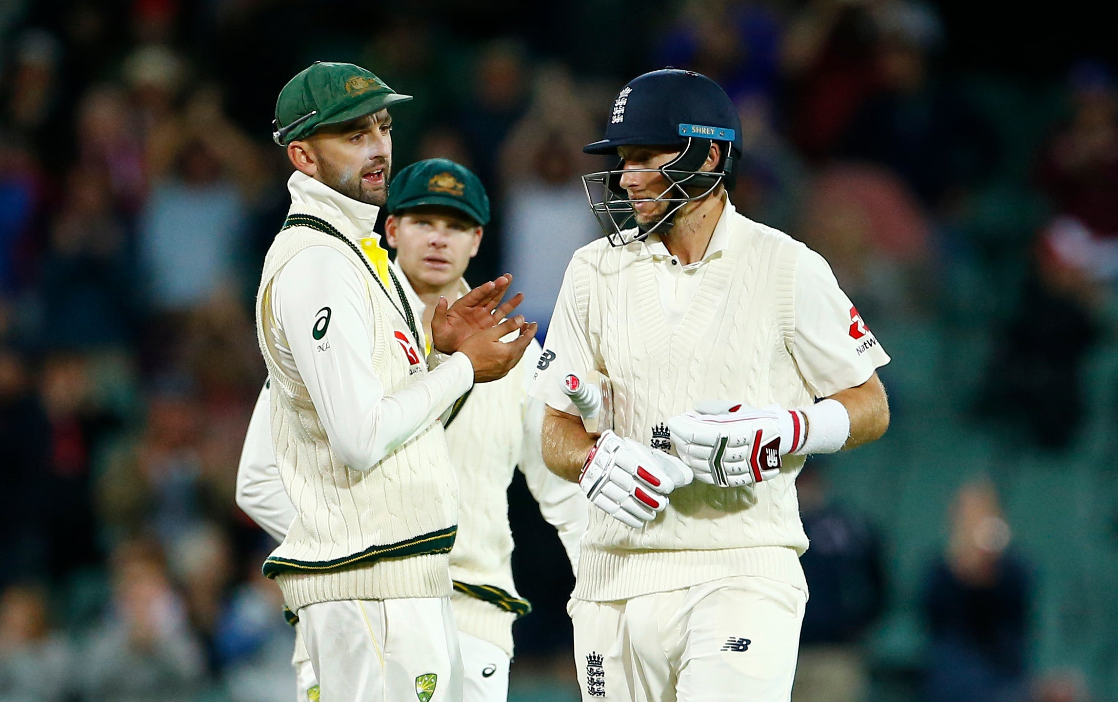 Nathan Lyon, left, and Joe Root exchange words in Adelaide in 2017 (Jason O’Brien/PA)