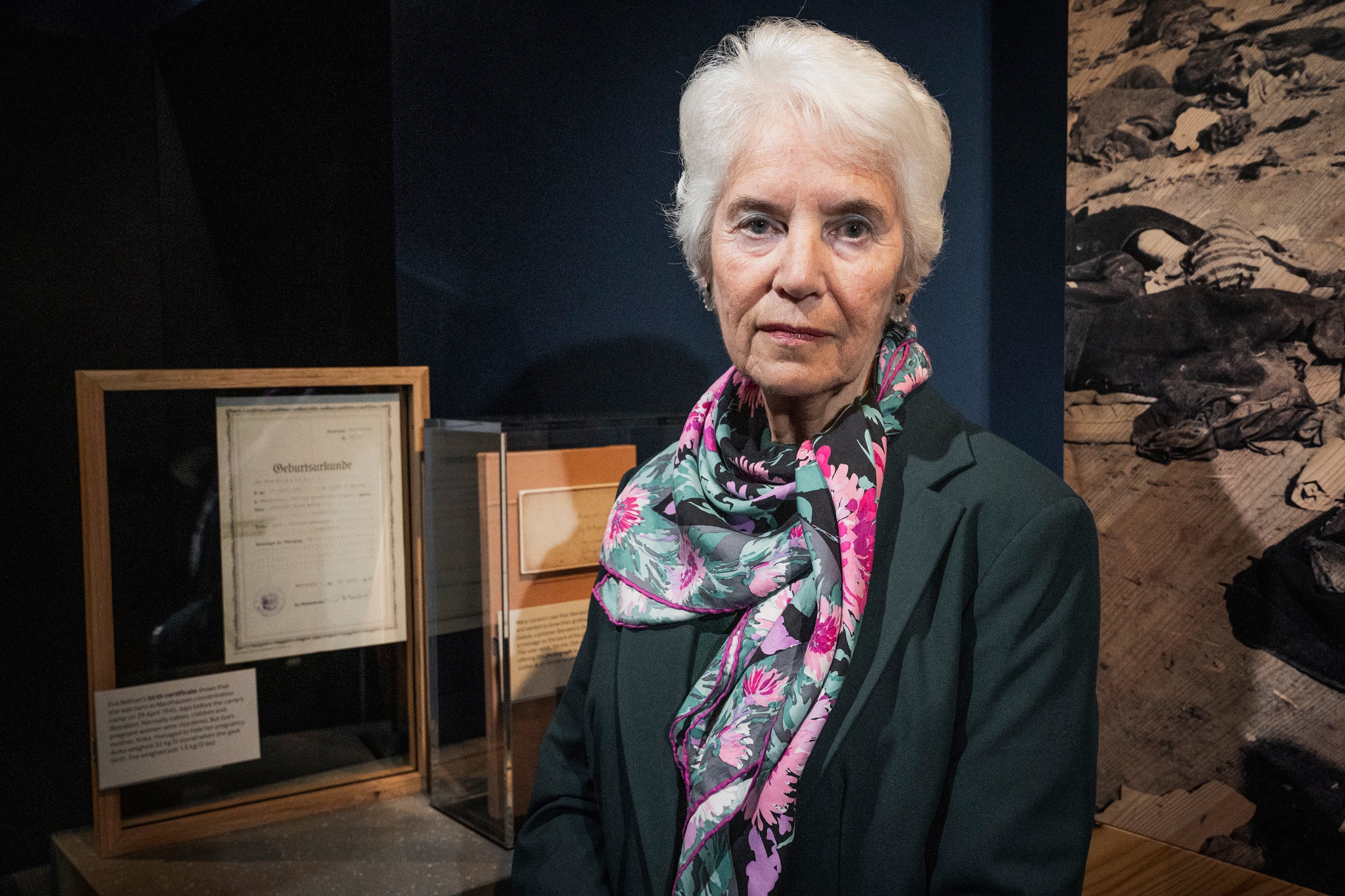 Holocaust survivor, Eva Clarke, next to her birth certificate displayed at the Imperial War Museum.