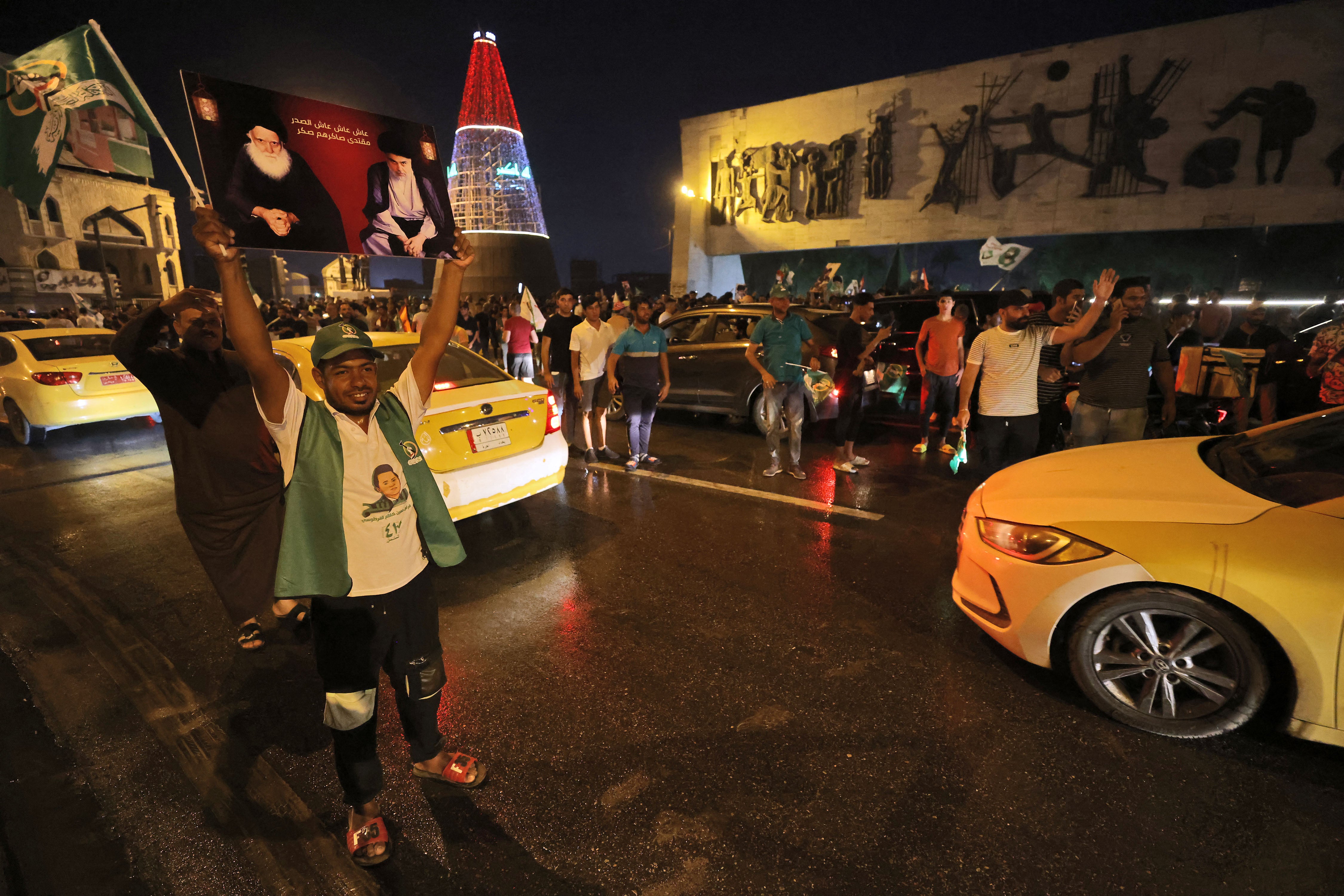 Supporters of Iraqi Shia cleric Muqtada al-Sadr celebrate in Baghdad’s Tahrir Square