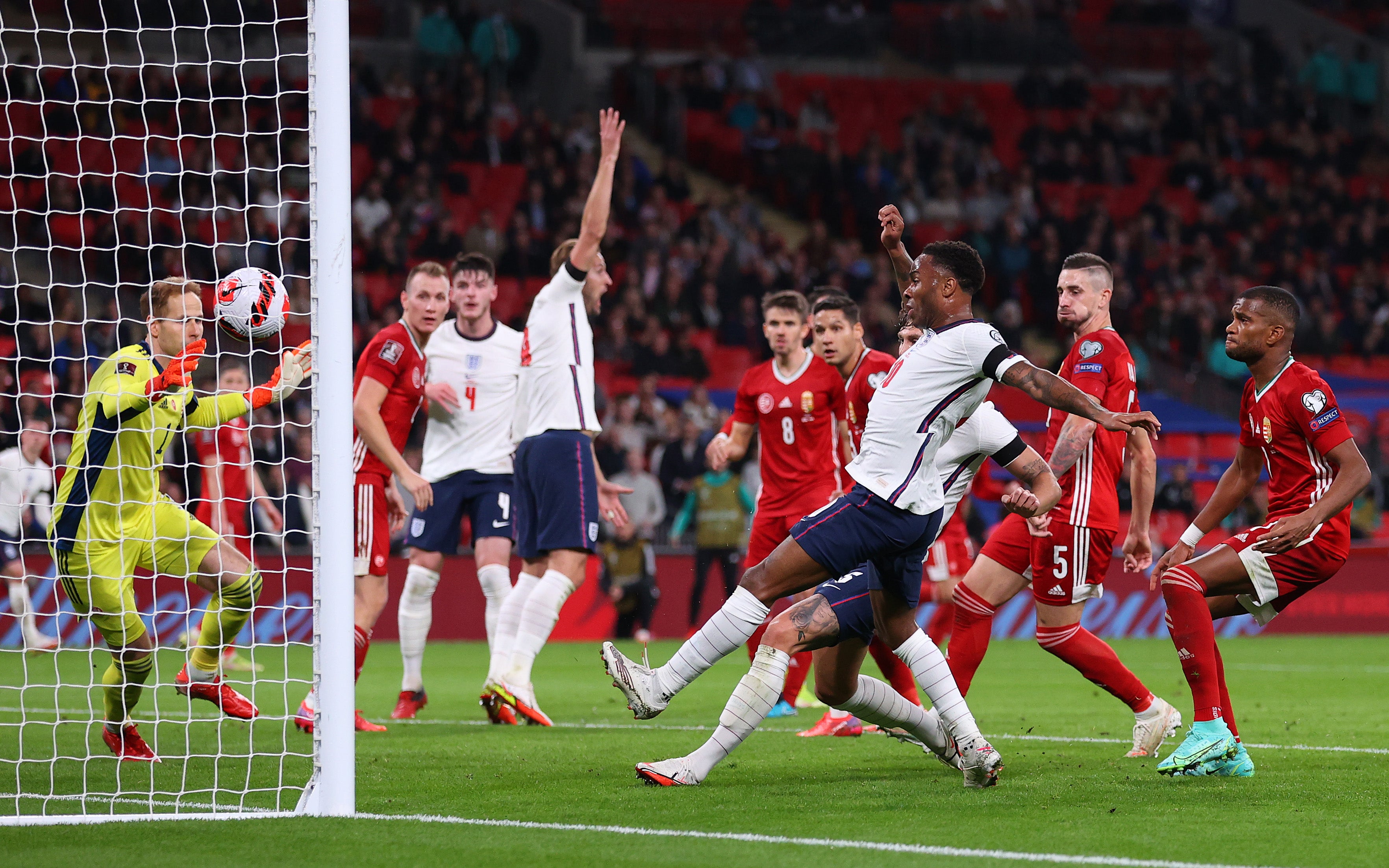 John Stones, hidden behind Raheem Sterling, scores for England