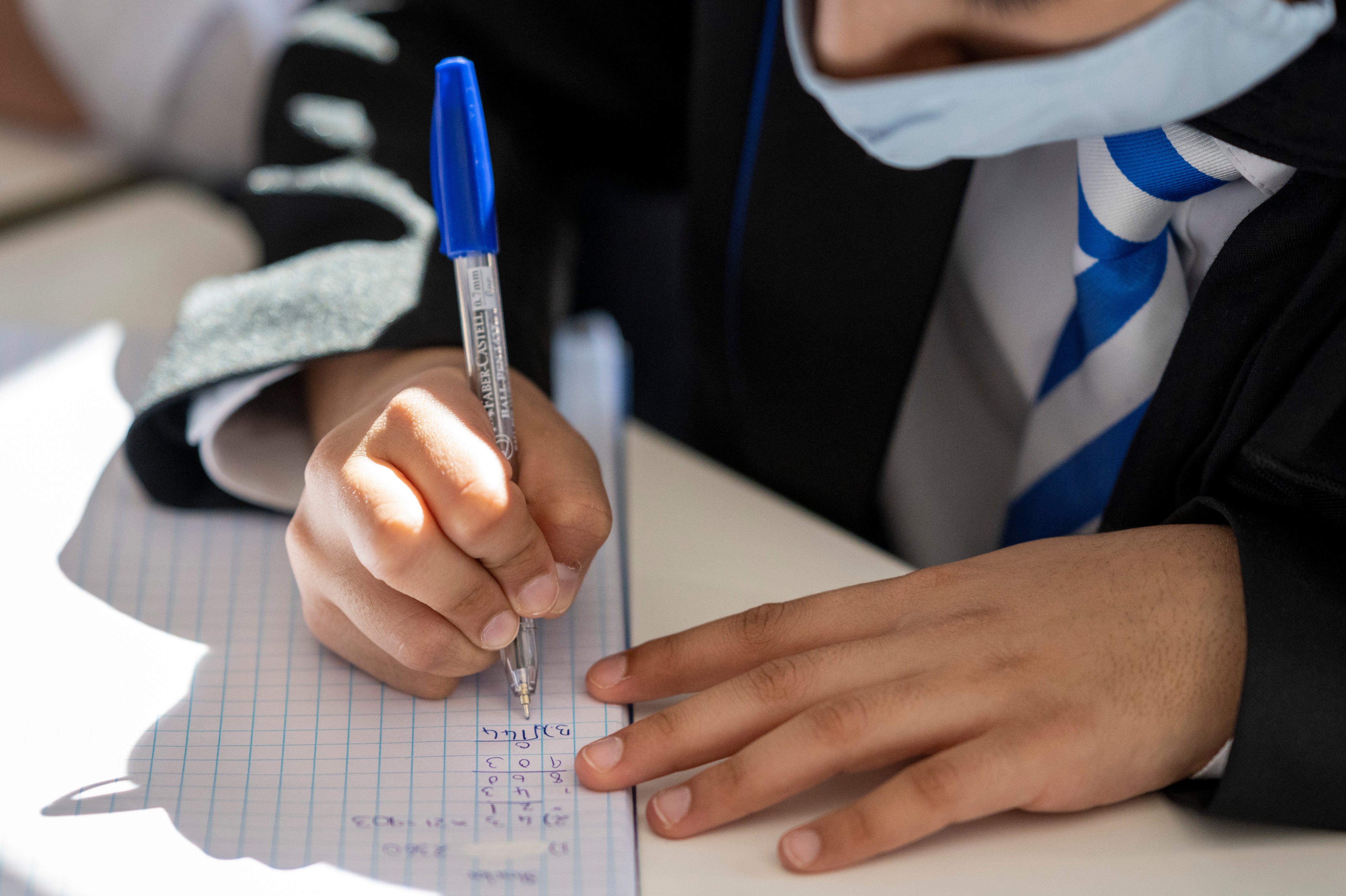 A child learning during a maths class at Llanishen High School in Cardiff, Wales