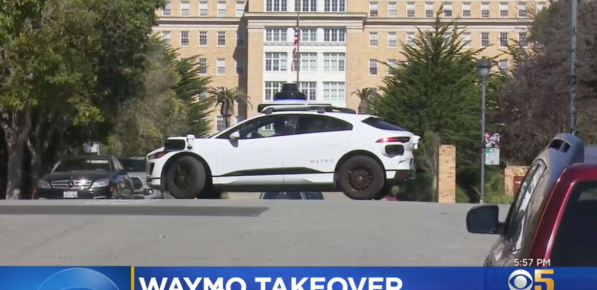 A Waymo self-driving car makes a multi-point turn on a dead-end San Francisco street