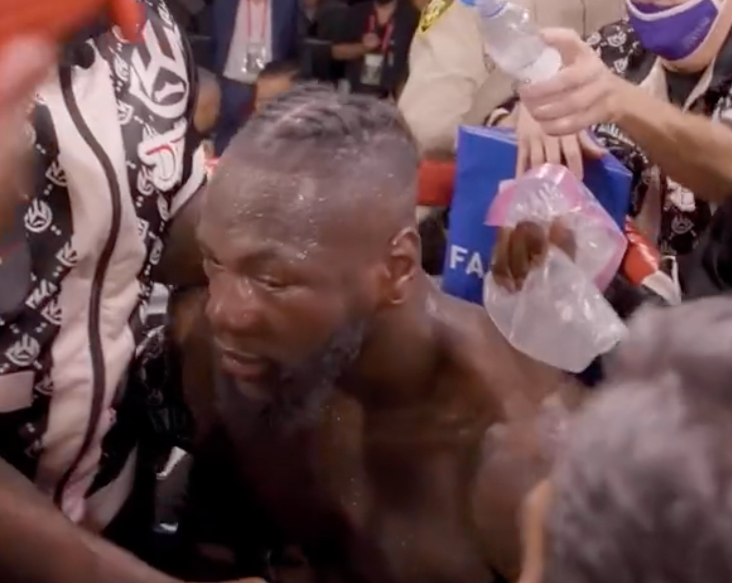 Tyson Fury and Deontay Wilder exchange words following their third fight