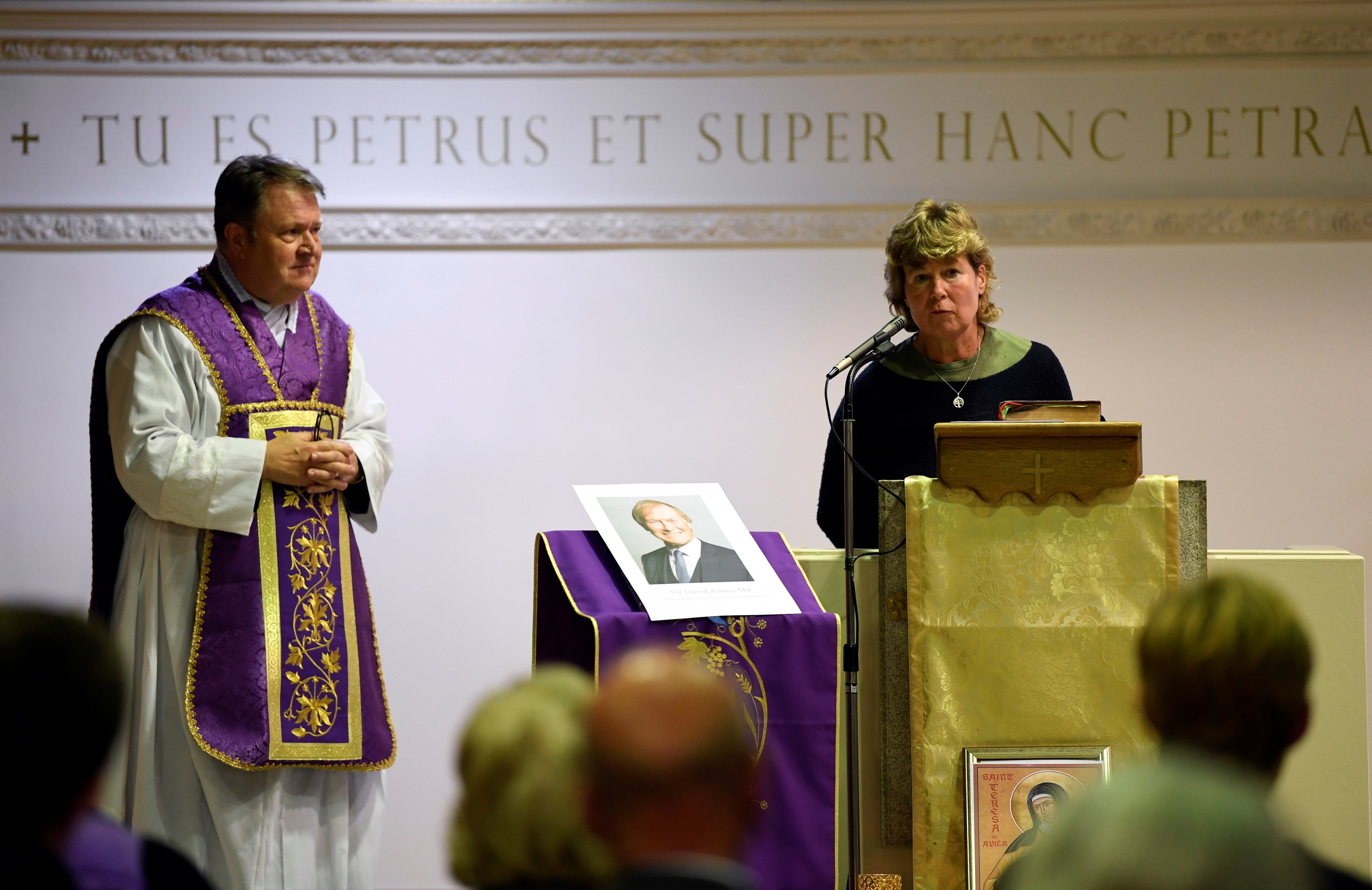 Father Jeffrey Woolnough with a member of the congregation, councillor Helen Boyd