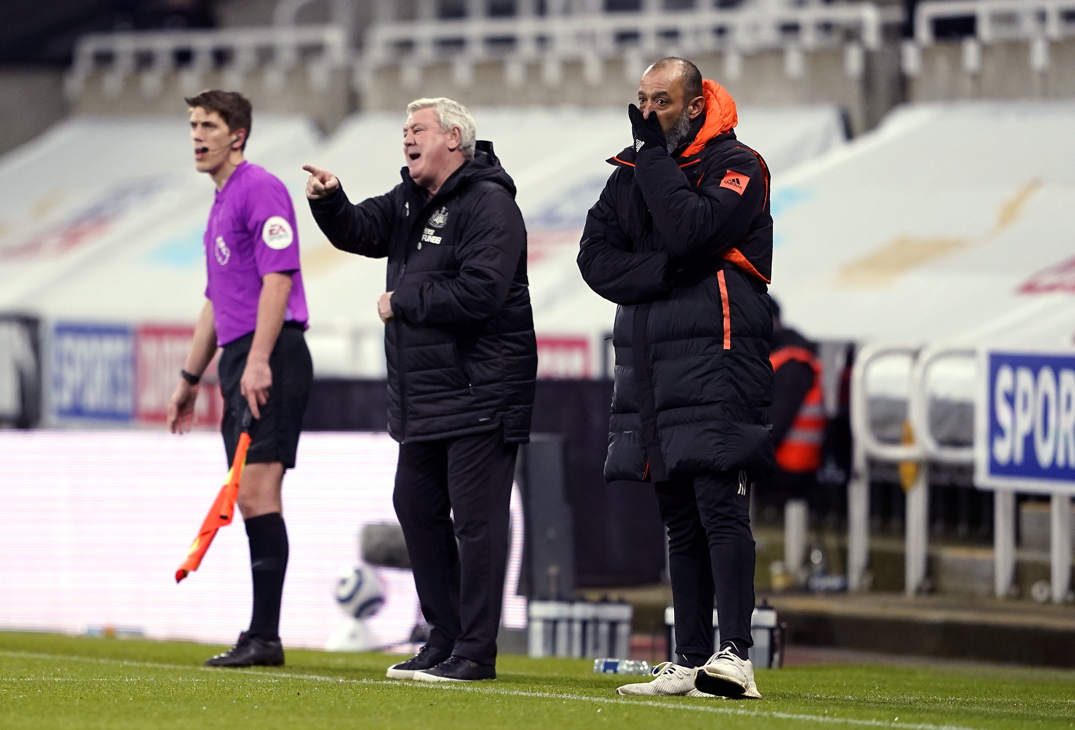 Nuno Espirito Santo (right) and Steve Bruce (centre) on the touchline at Newcastle v Wolves last season (Owen Humphreys/PA)