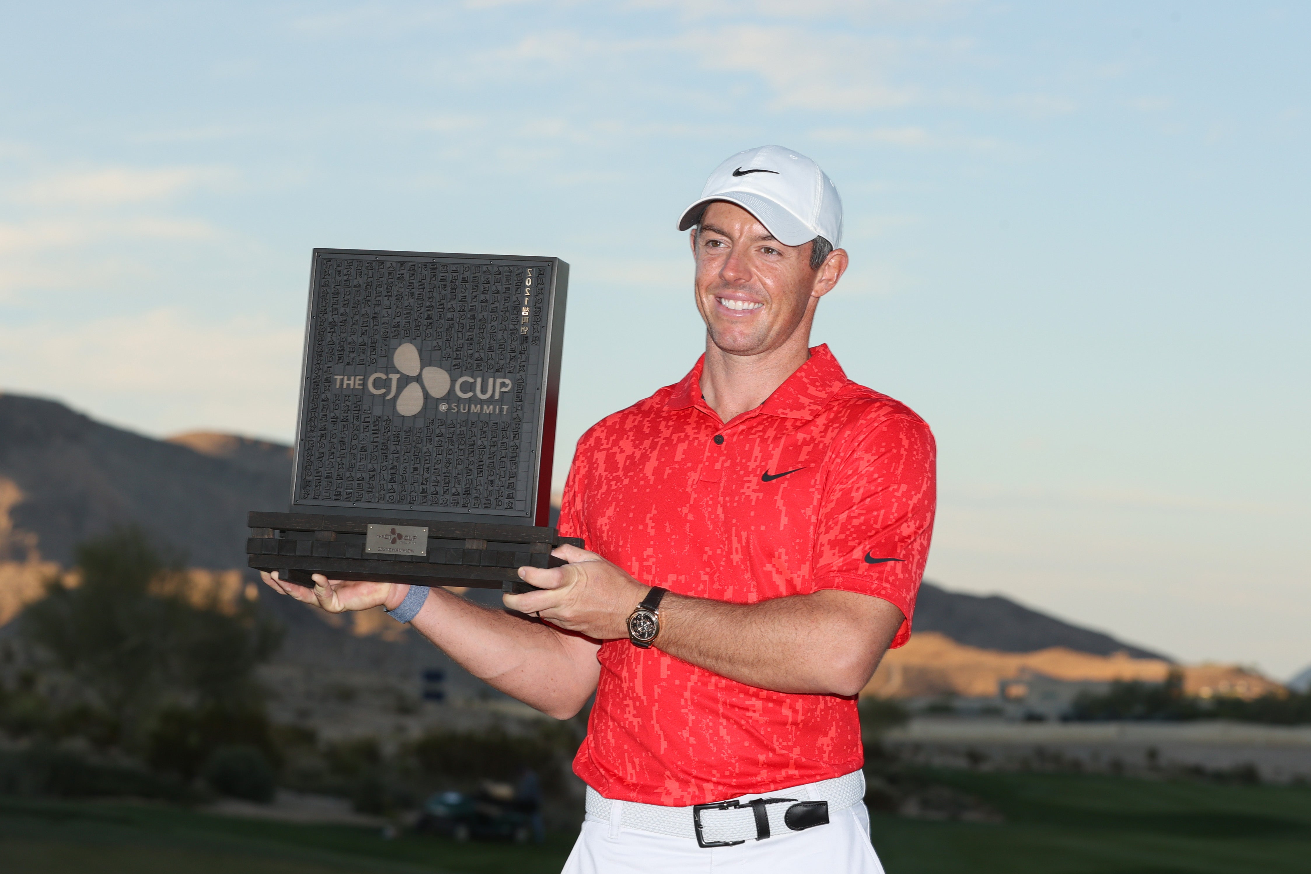 Rory McIlroy of Northern Ireland celebrates with the trophy