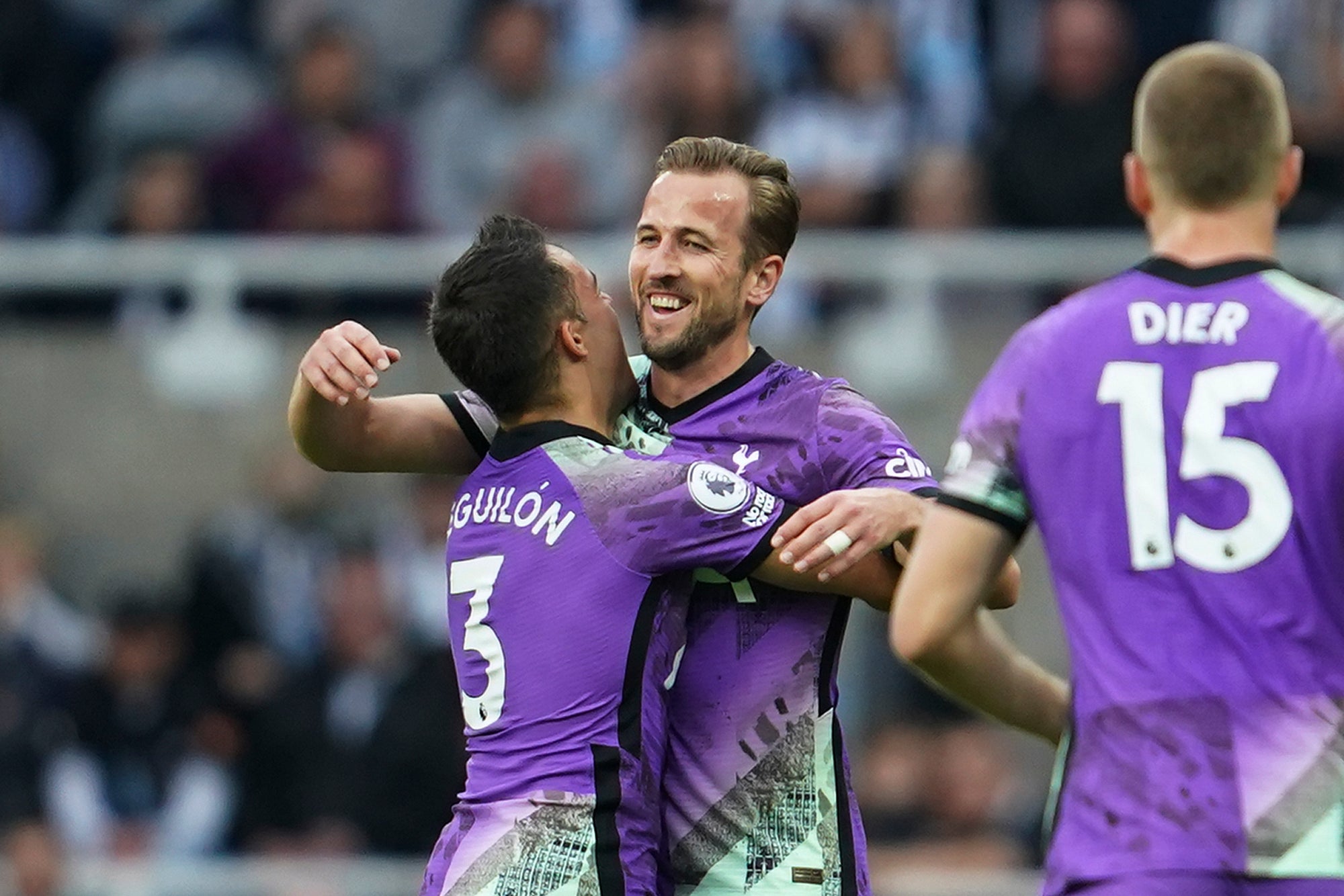 Kane (centre) celebrates his goal against Newcastle (Jon Super/AP)