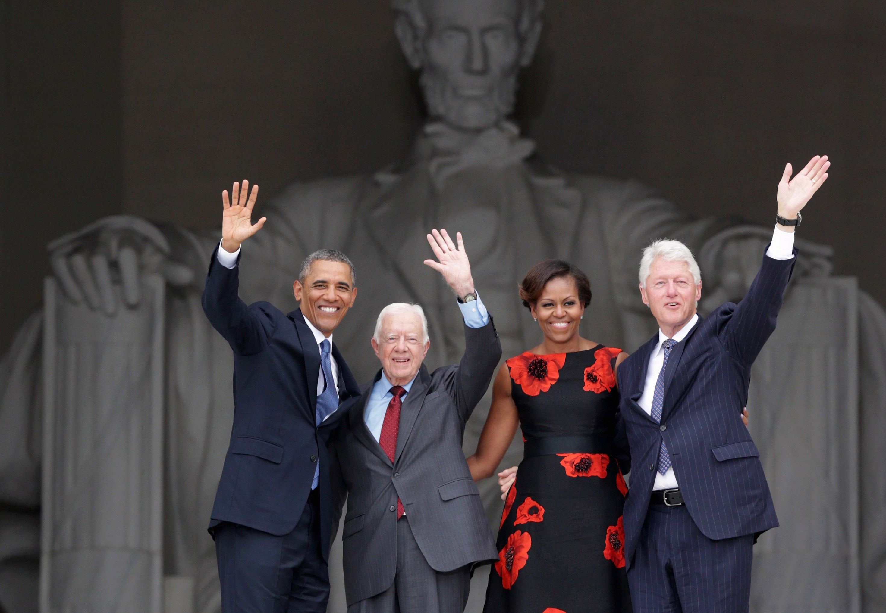 US former presidents Barack Obama, Jimmy Carter and Bill Clinton, joined by former first lady Michelle Obama, 10 years ago at the Lincoln Memorial