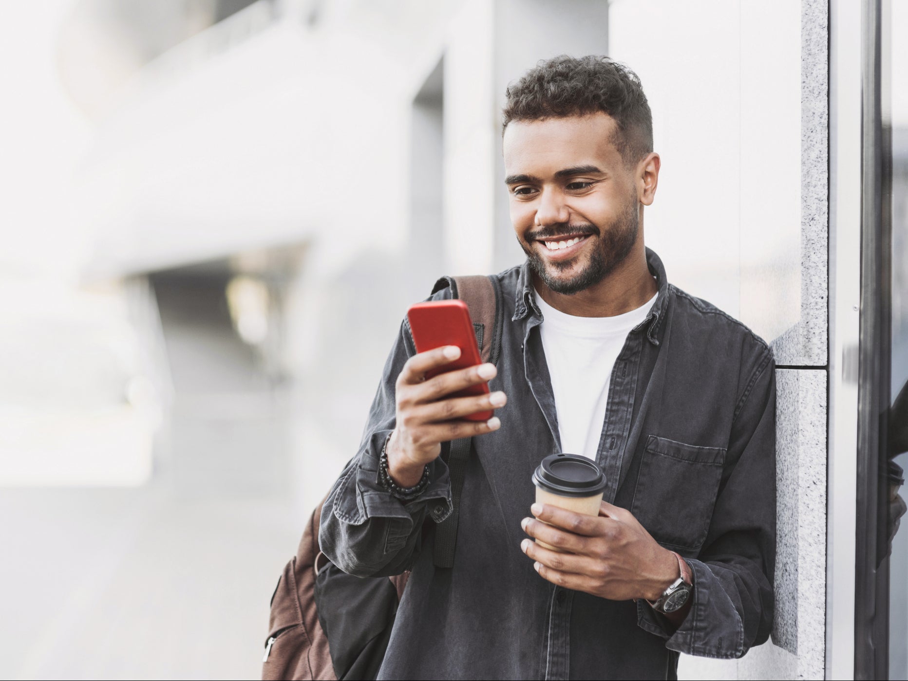 A young person looks at memes on his mobile phone