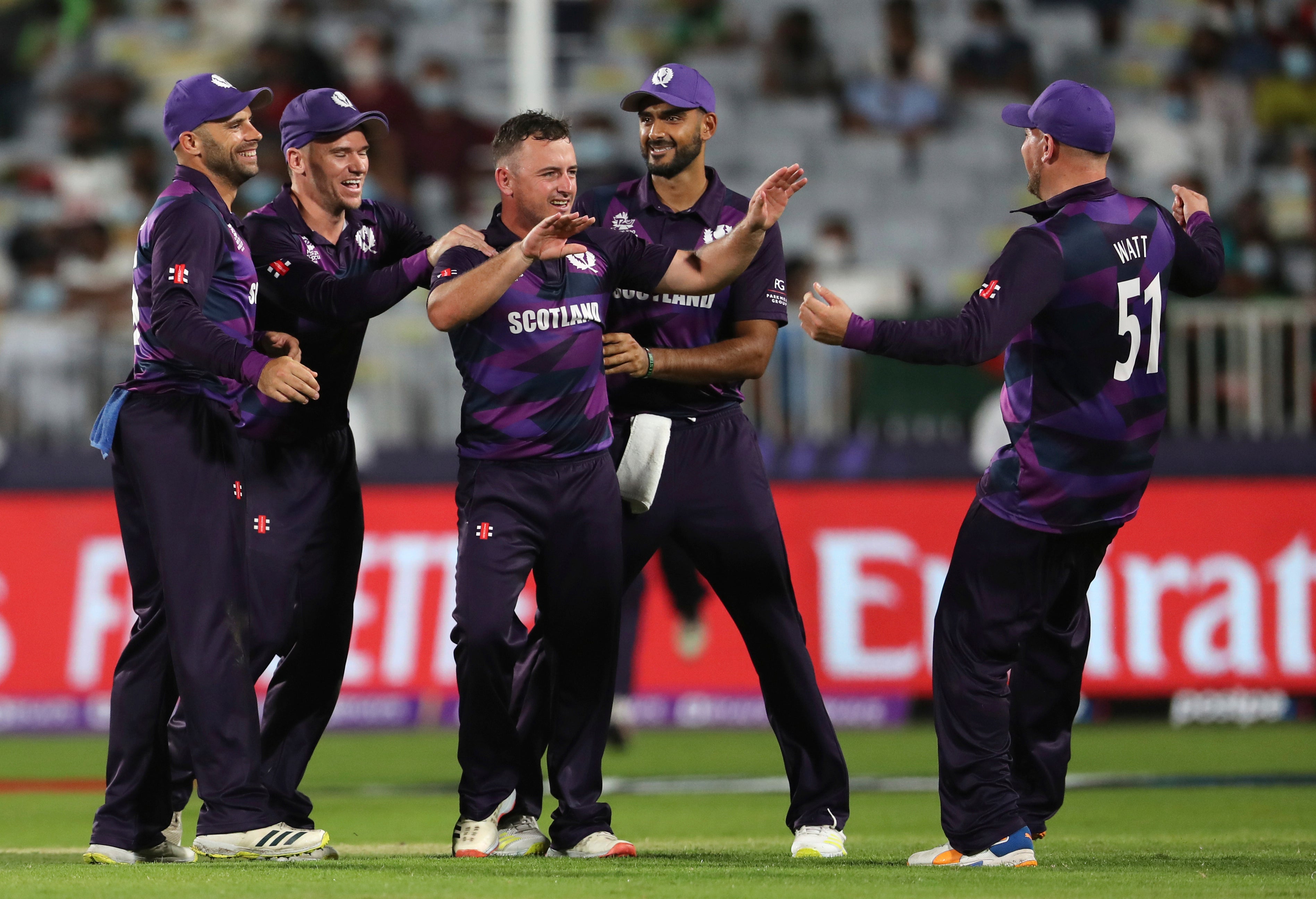 Scotland’s bowler Chris Greaves, middle, celebrates after taking a wicket against Bangladesh (Kamran Jebreili/AP)