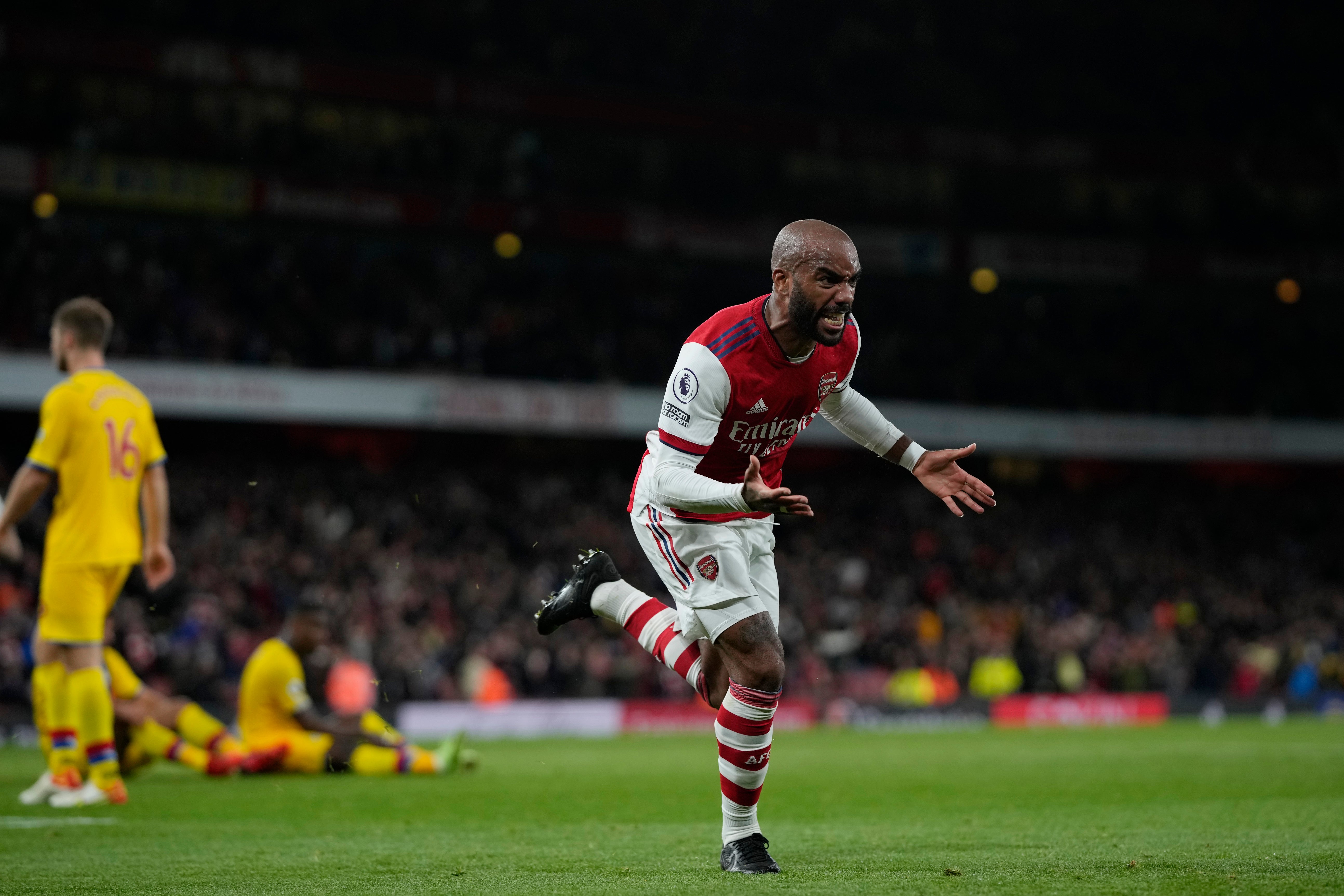 Lacazette wheels away to celebrate after his stoppage-time equaliser