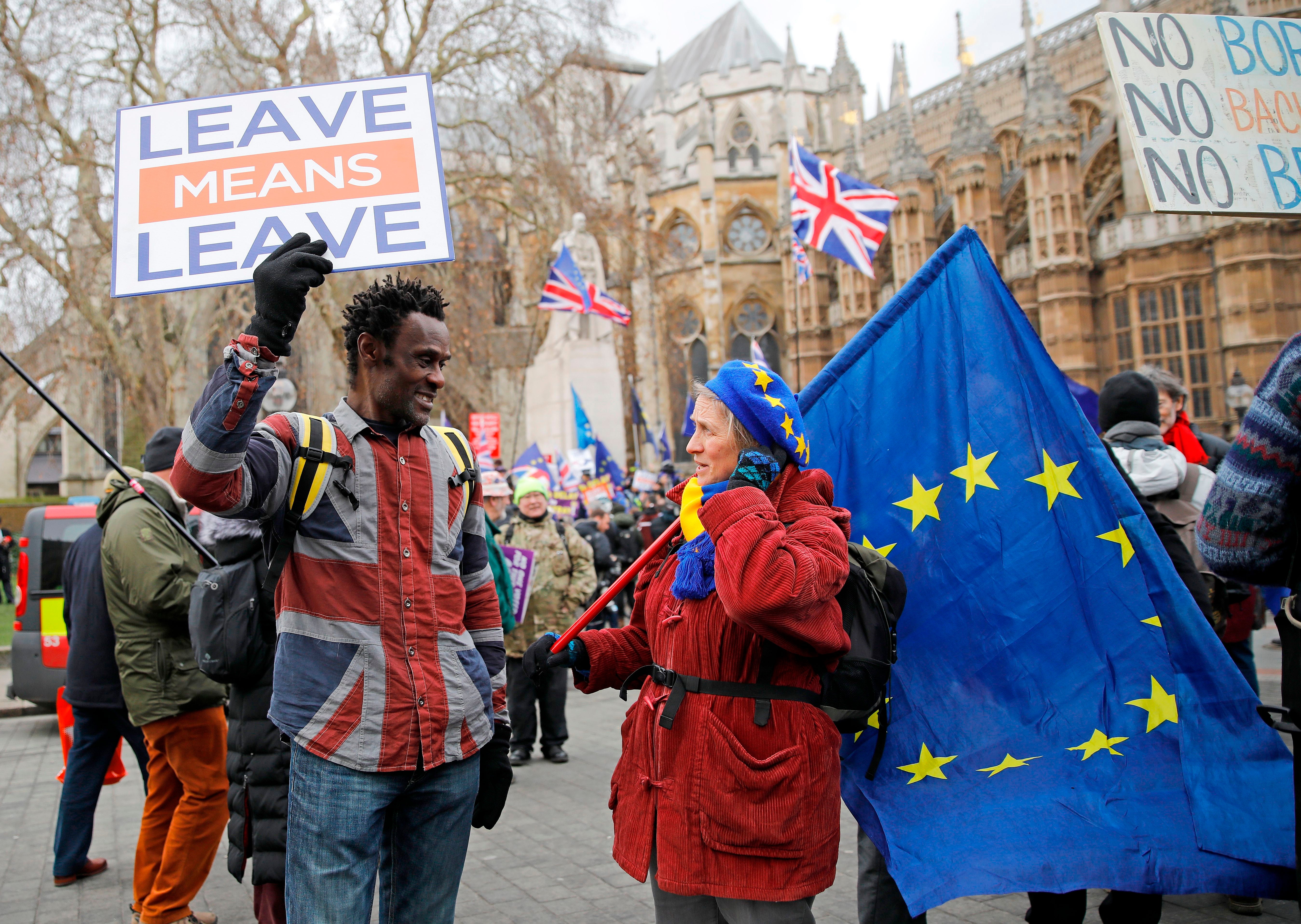 A pro-Brexit activist chats to an anti-Brexit demonstrator