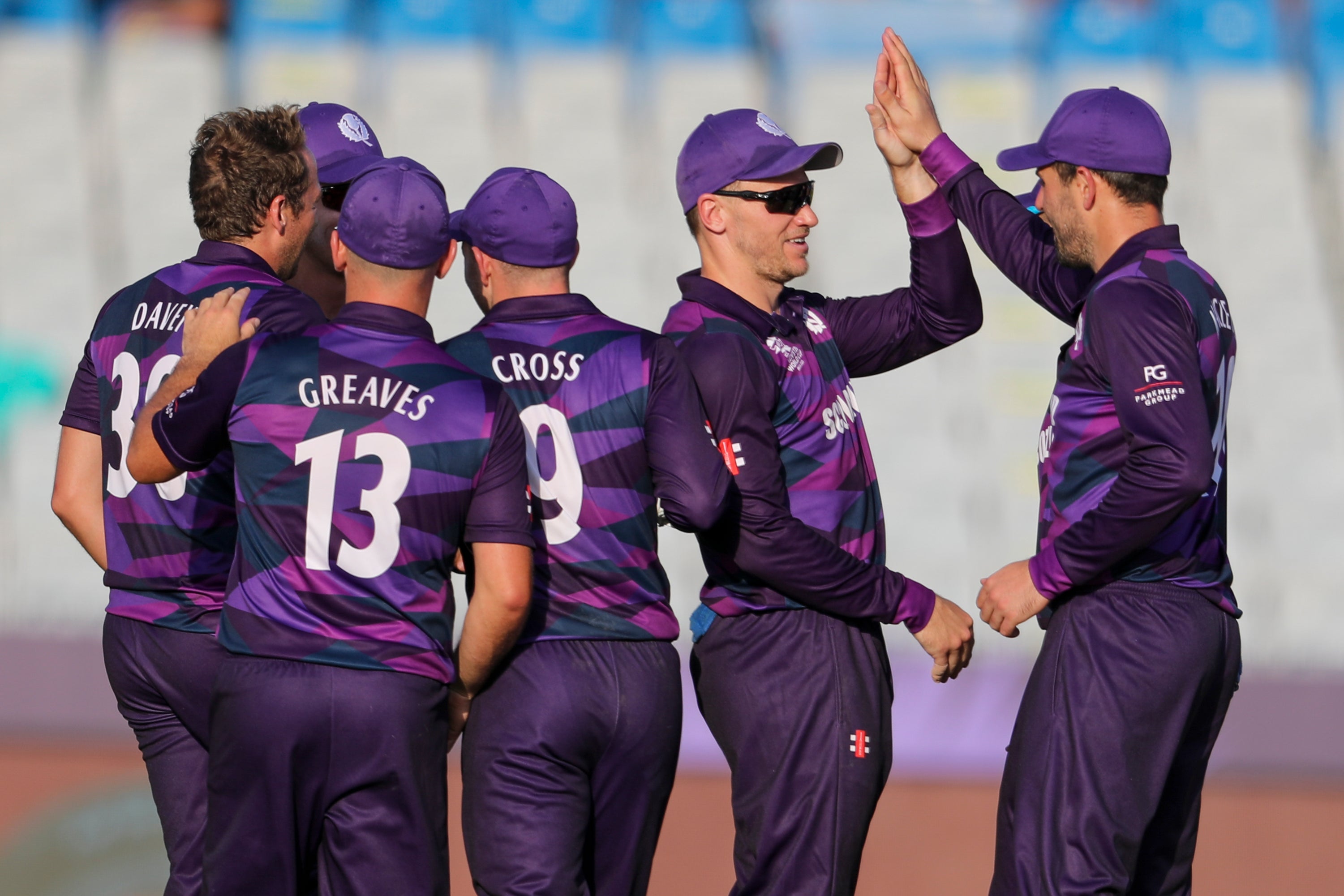 Scotland players celebrate against Papua New Guinea (Kamran Jebreili/AP).