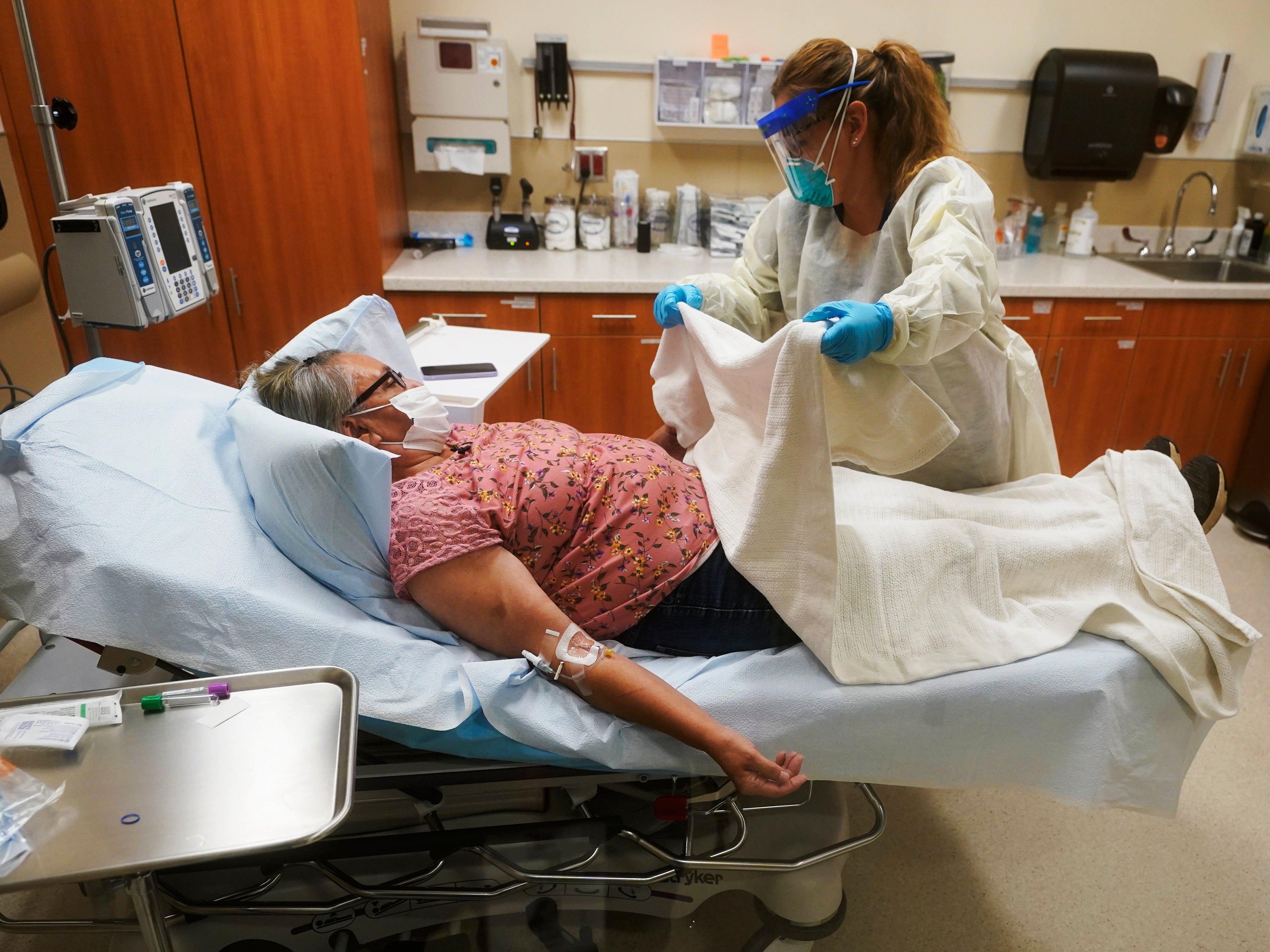 A Covid-19 patient receives an antibody infusion at the Upper Tanana Health Center in Tok, Alaska