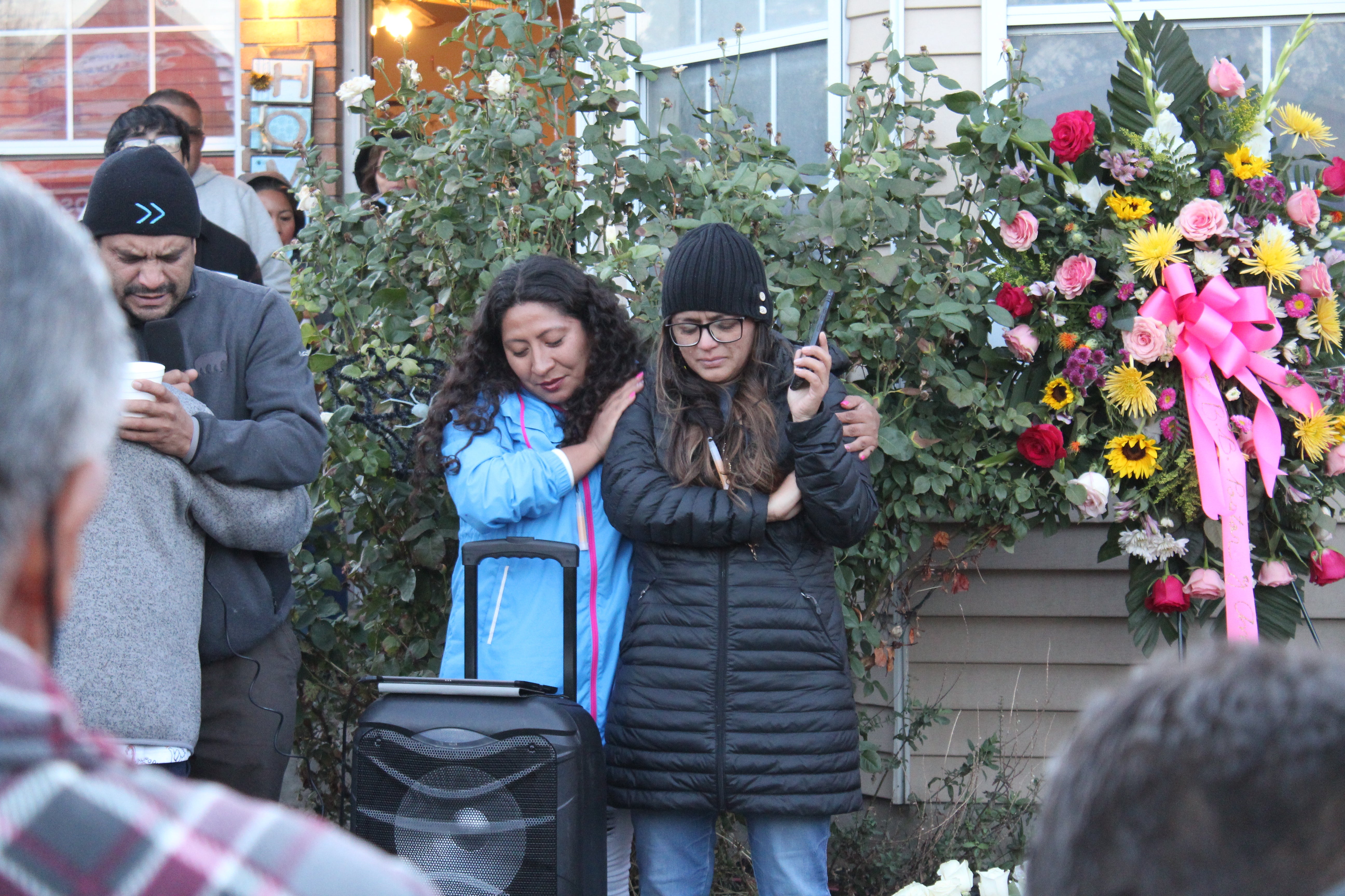 Fellow KMRI radio personality Monica Acuña, left, comforts Rocio Sifuentes during a vigil in honor of Gaby Ramos on Tuesday, 19 October.