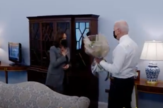 President Biden surprises Kamala Harris with birthday flowers and a gift in video