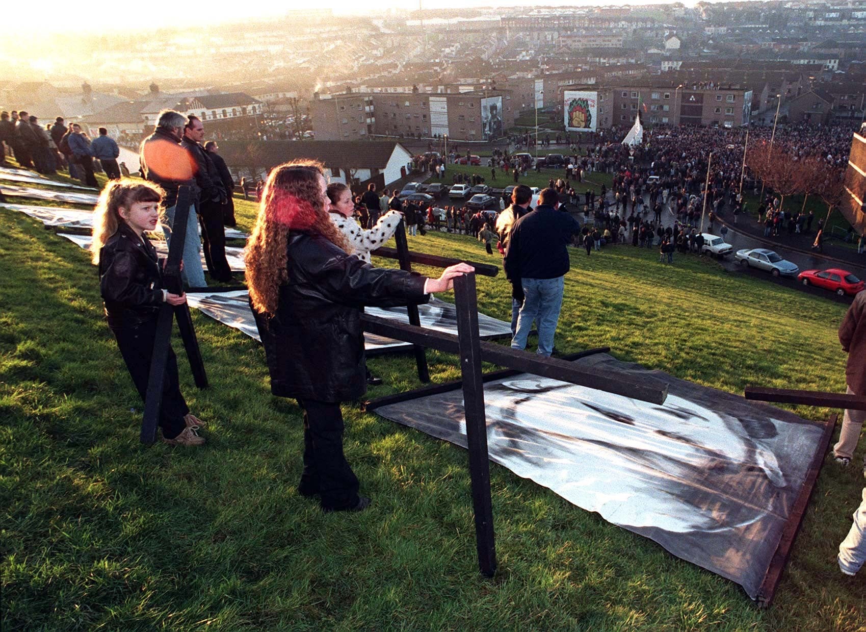 Crosses are raised on the city walls of Londonderry in February 1997 after a march to mark the 25th Anniversary of the shootings by paratroopers