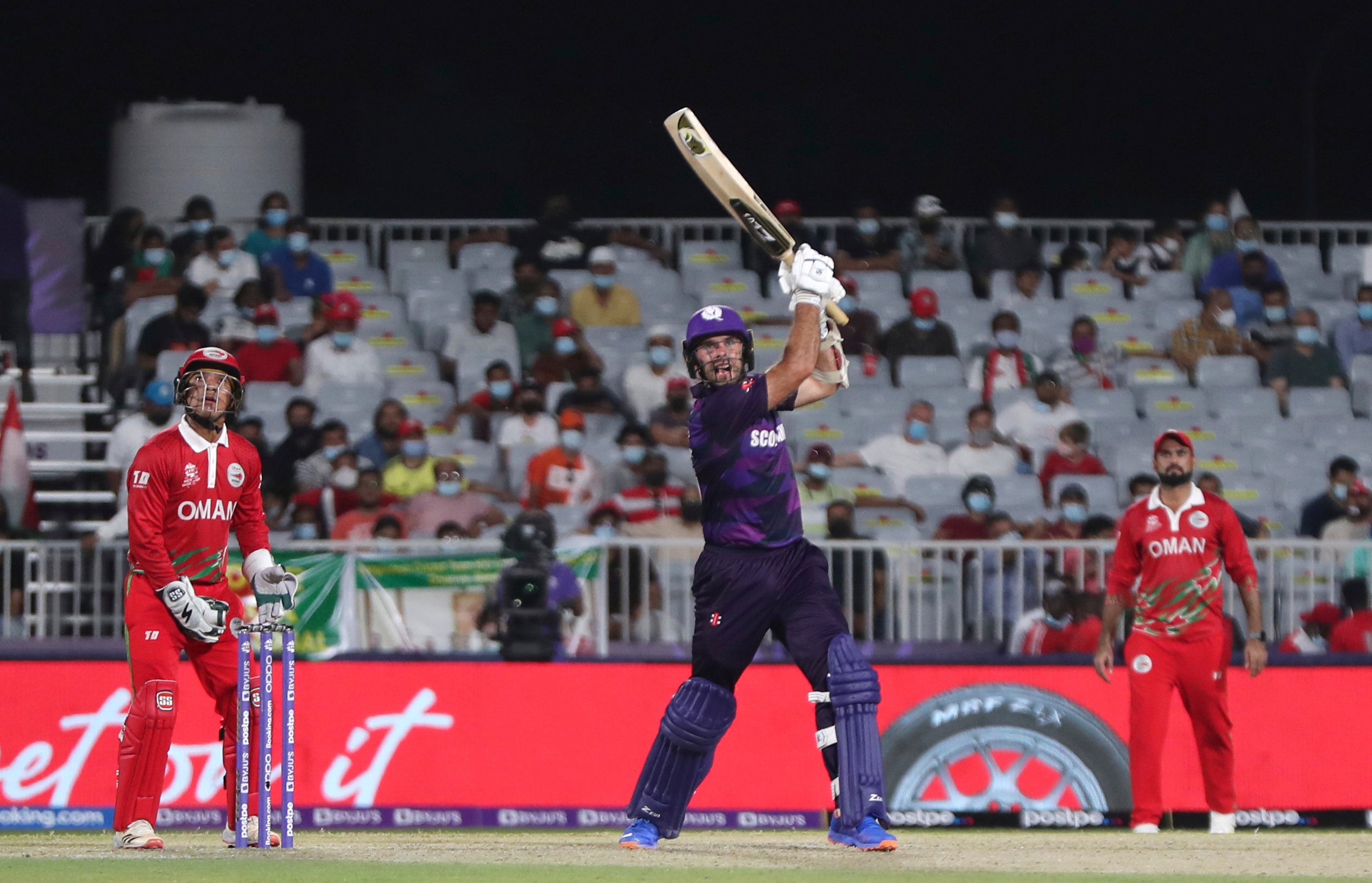 Scotland’s captain Kyle Coetzer, centre, helped his side book their spot in the Super 12 stage of the T20 World Cup (Kamran Jebreili/AP)