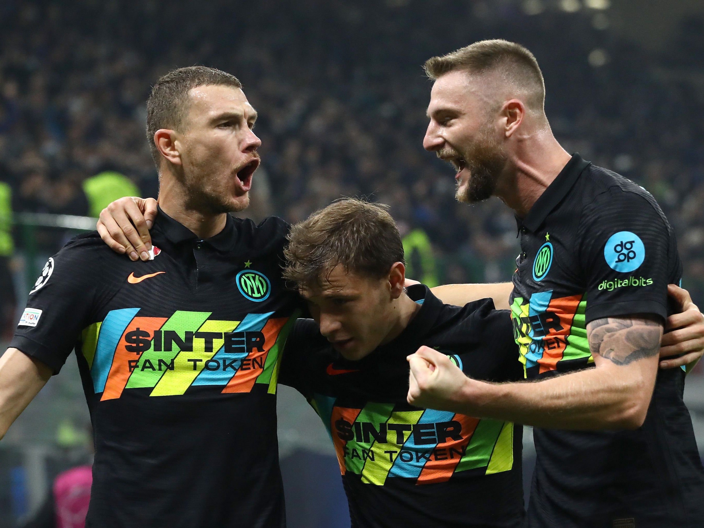 Edin Dzeko celebrates with Nicolo Barella and Milan Skriniar