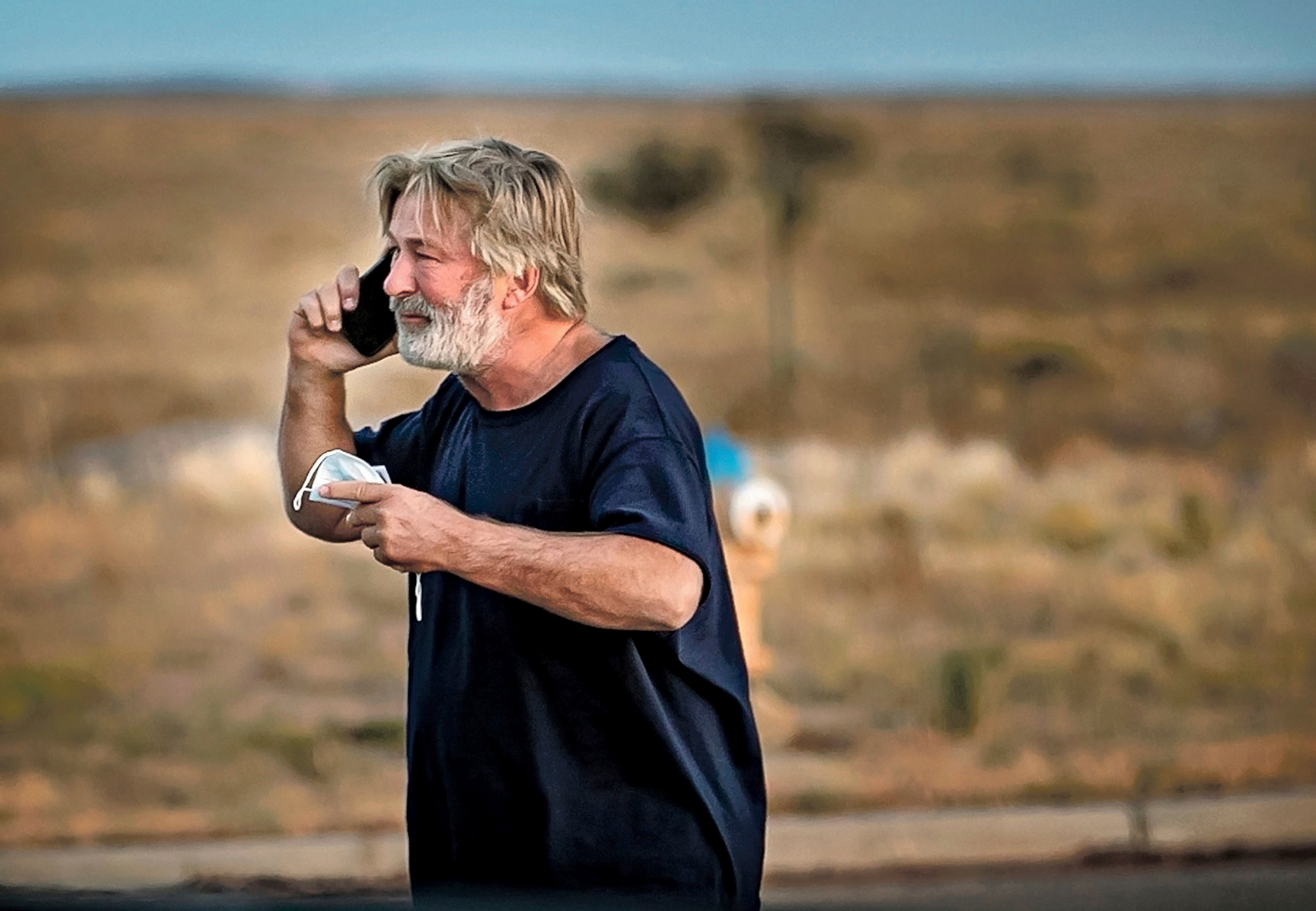 A distraught Alec Baldwin is seen speaking on the phone outside the Santa Fe County Sheriff’s Office on Thursday night