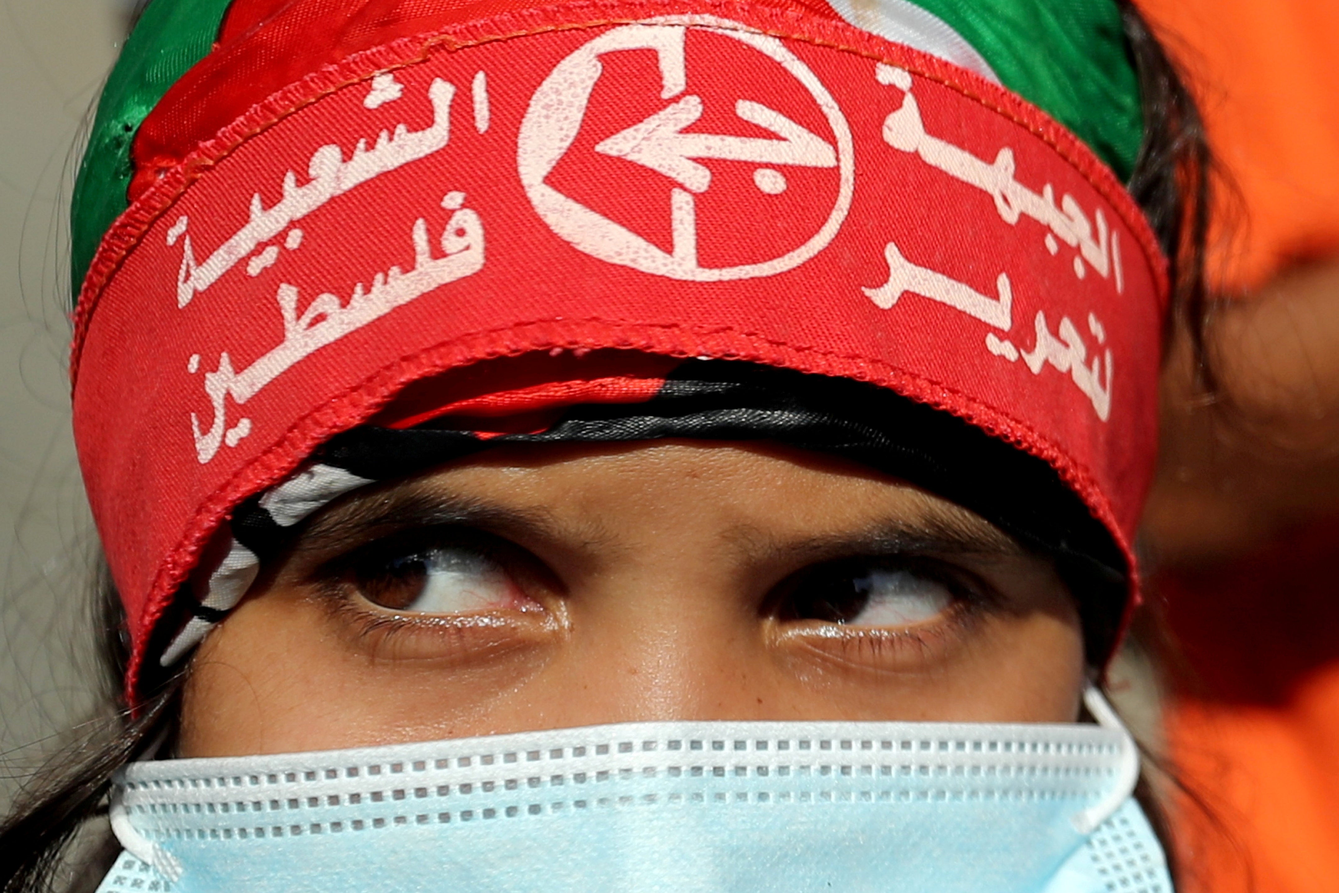 A girl wearing a headband of the Popular Front for the Liberation of Palestine