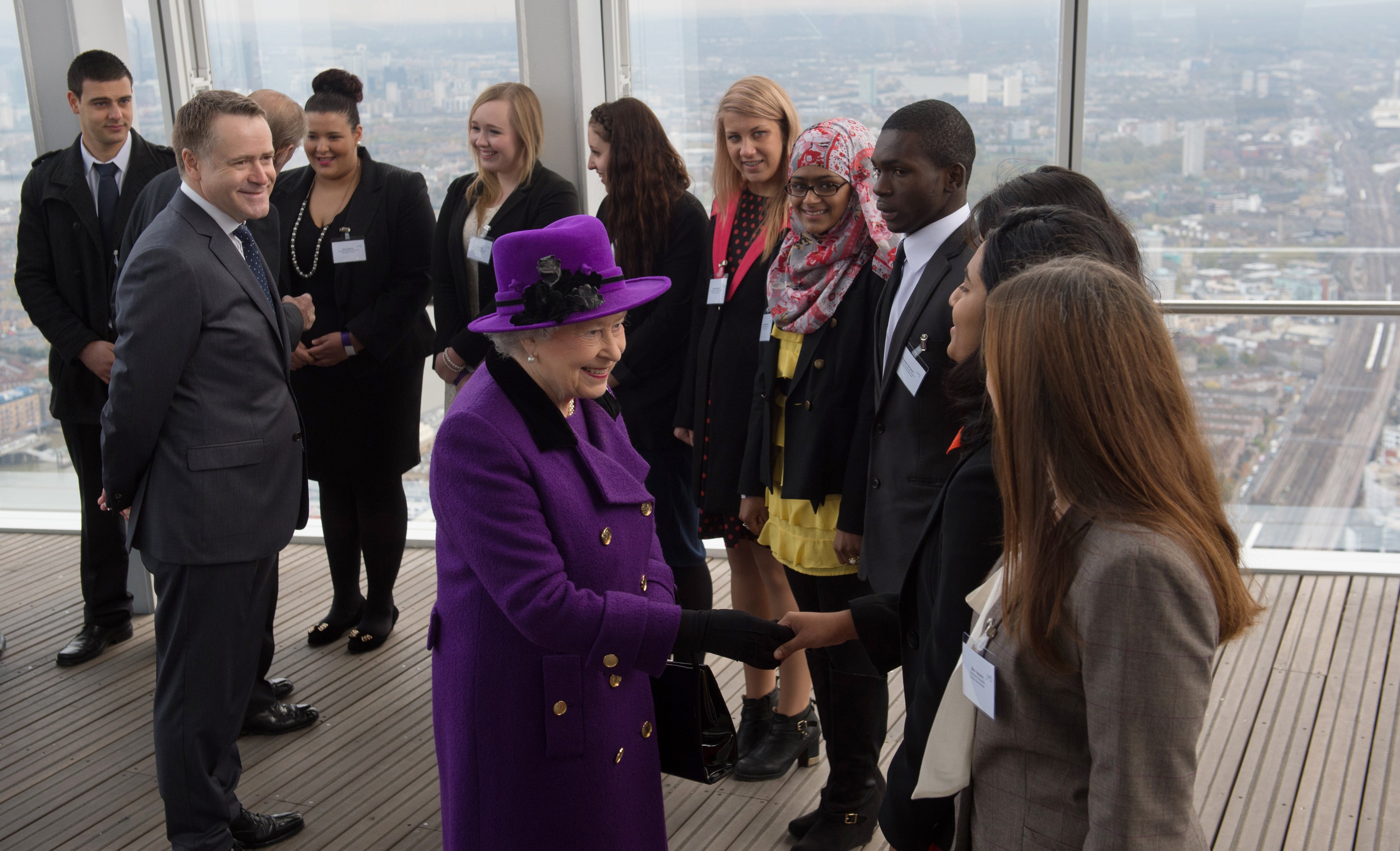 Queen Elizabeth II meets young people during an official visit to The Shard building in central London, 2013