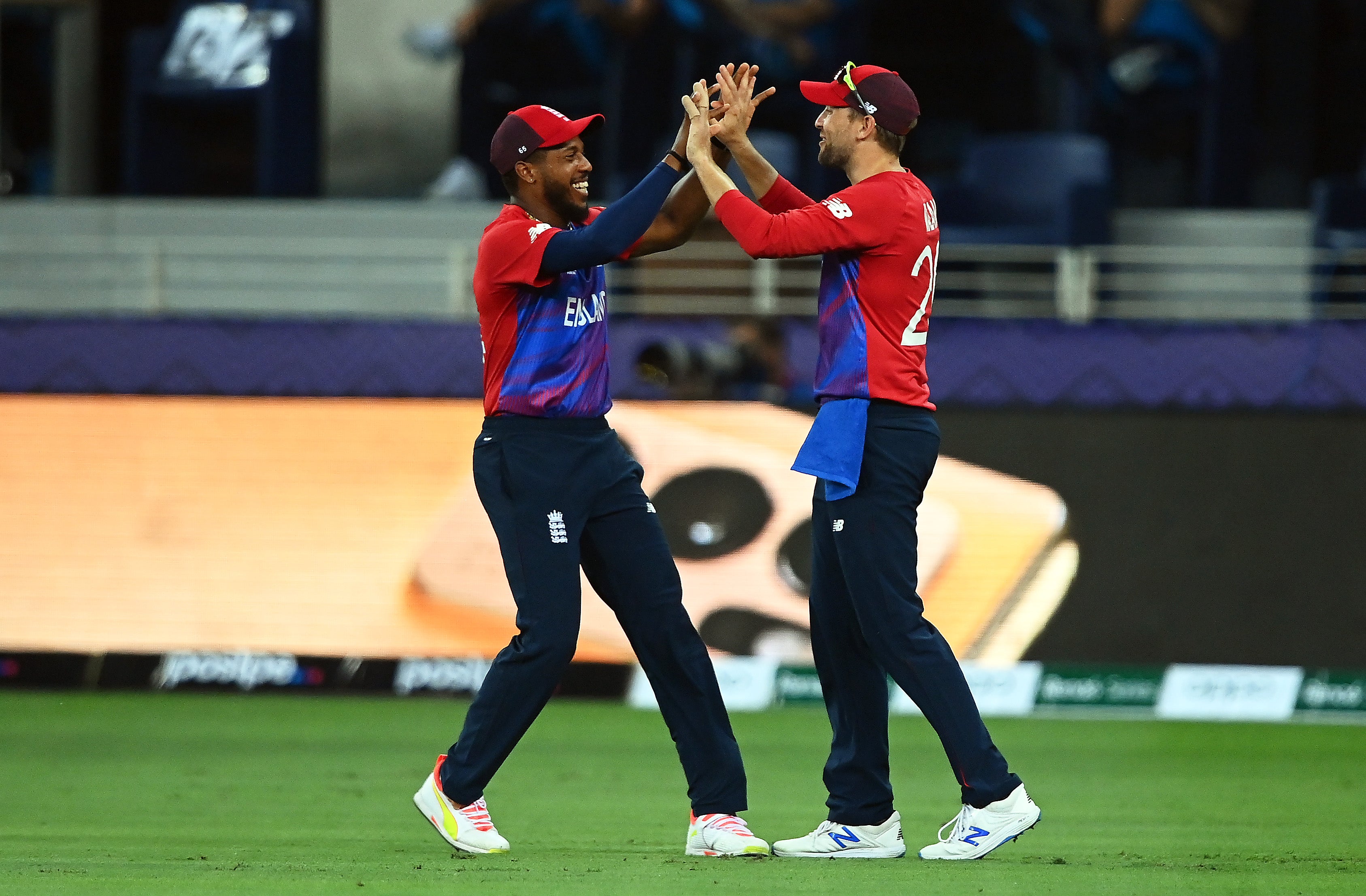 Chris Jordan and Dawid Malan celebrate the wicket of Chris Gayle