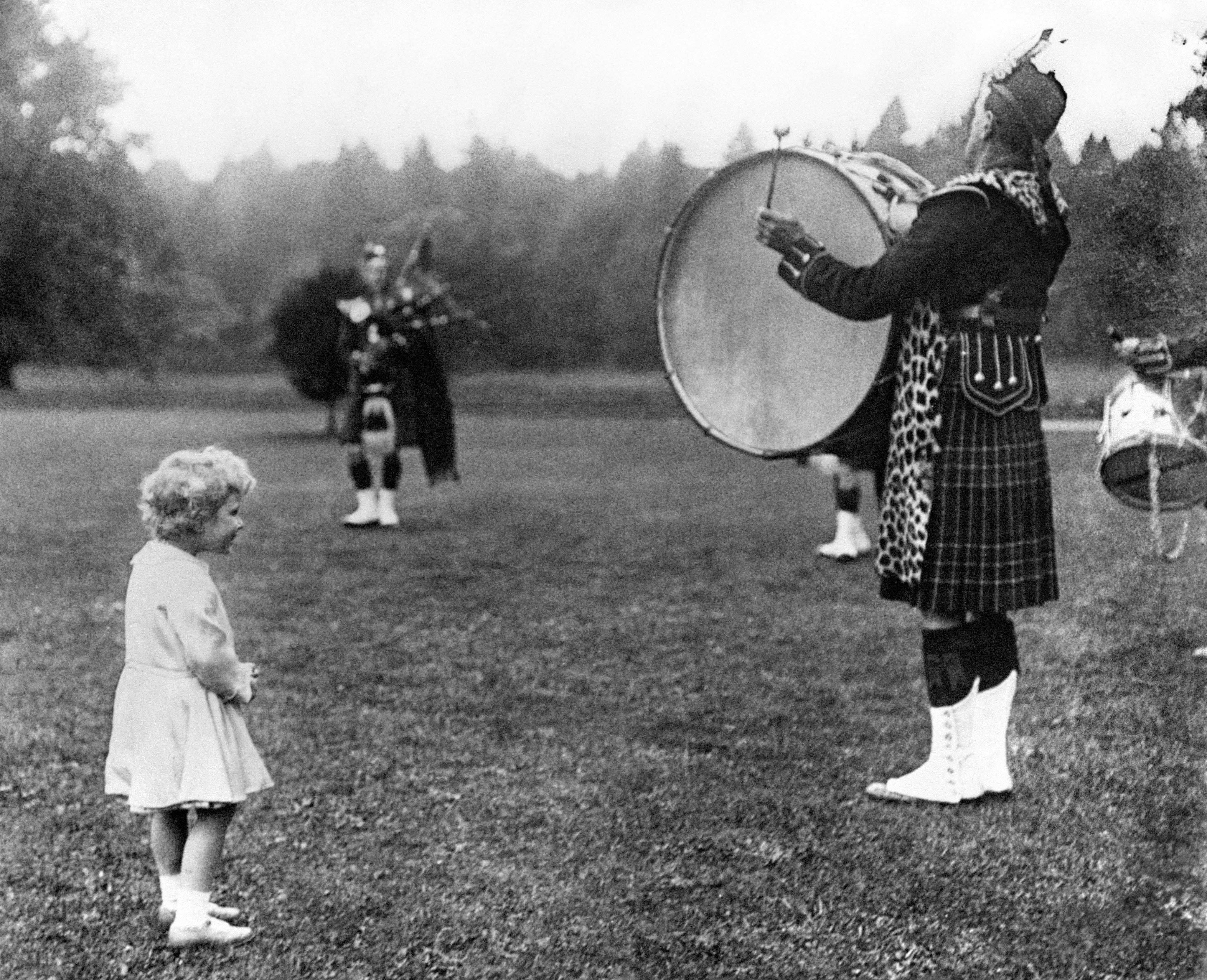 Princess Elizabeth and a Highland Regiment drummer, during a visit to Scotland in 1929