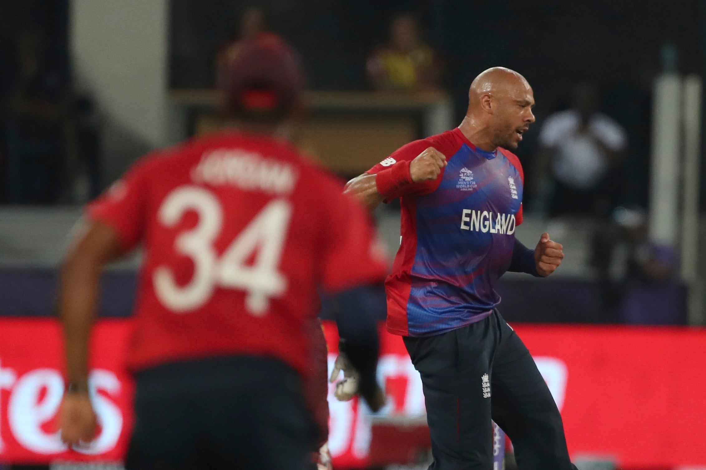 Tymal Mills celebrates the wicket of Nicholas Pooran (Aijaz Rahi/AP).