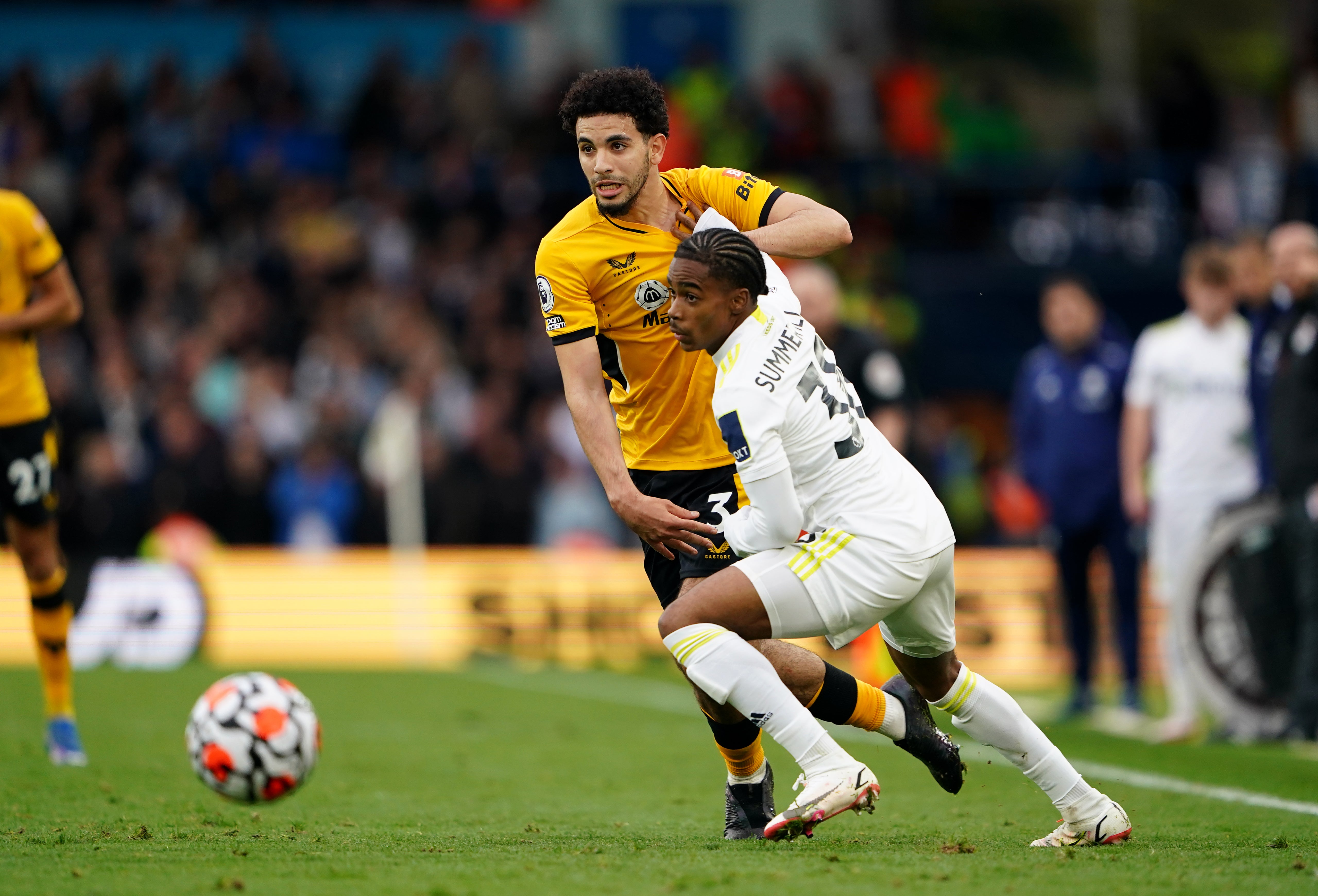 Crysencio Summerville, right, battles for the ball with Wolves’ Rayan Ait-Nouri (Zac Goodwin/PA)