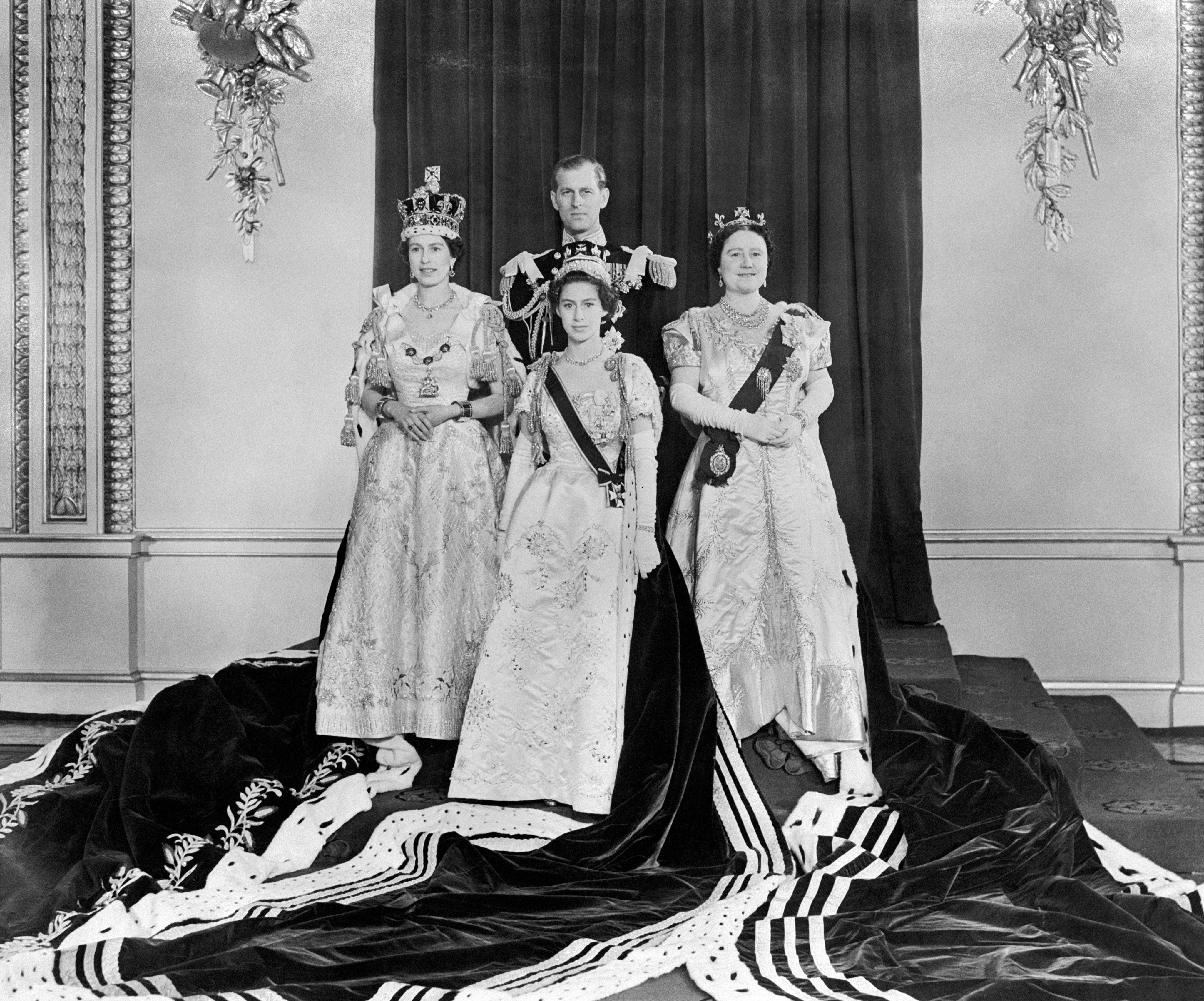 Queen Elizabeth II, left, at Buckingham Palace after her Coronation at Westminster Abbey. With her are the Duke of Edinburgh, back, Princess Margaret, front, and the Queen Mother, right