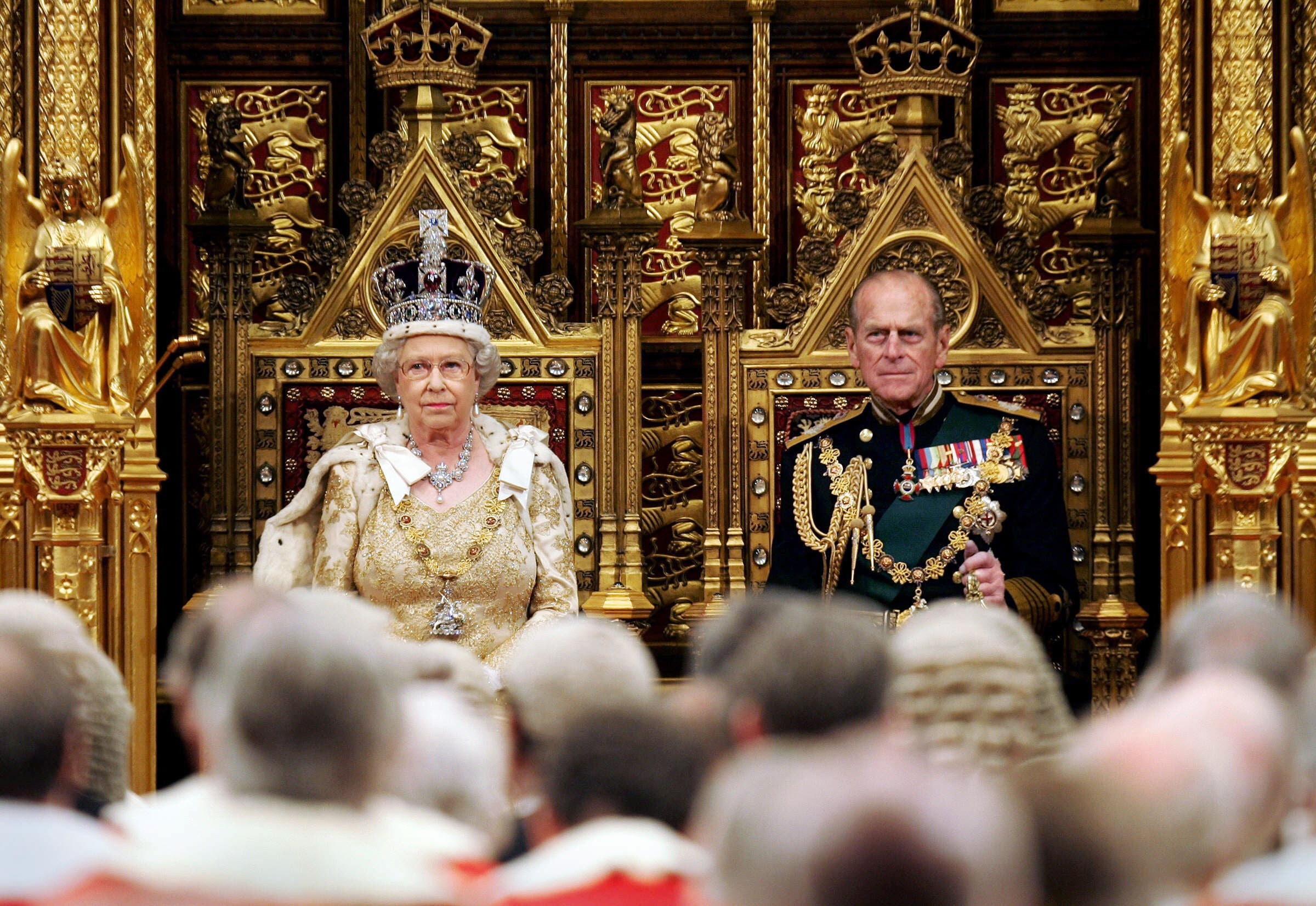 Queen Elizabeth II and the Duke of Edinburgh, Prince Philip sit before The House of Lords prior to giving the Queen's Speech during The State Opening of Parliament at The Palace of Westminster in London 23 November 2004