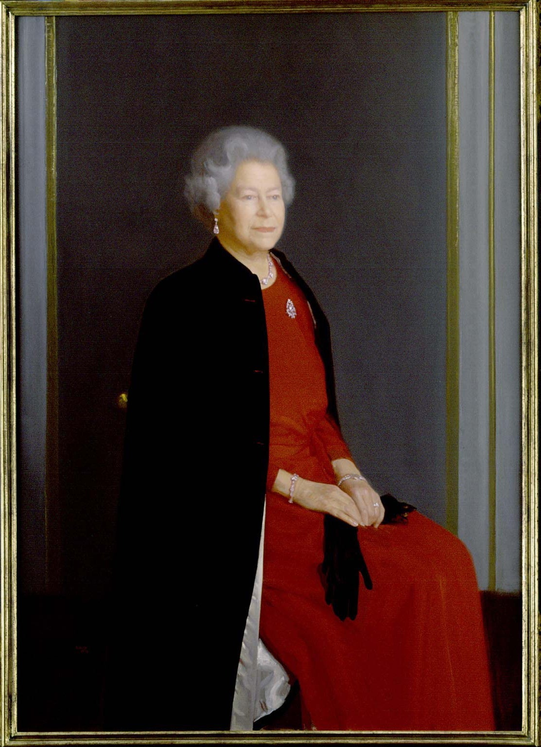 A new portrait of H.M The Queen by Robert Wraith is unveiled at a private view of the Royal Society of Portrait Painter's Exhibition in London