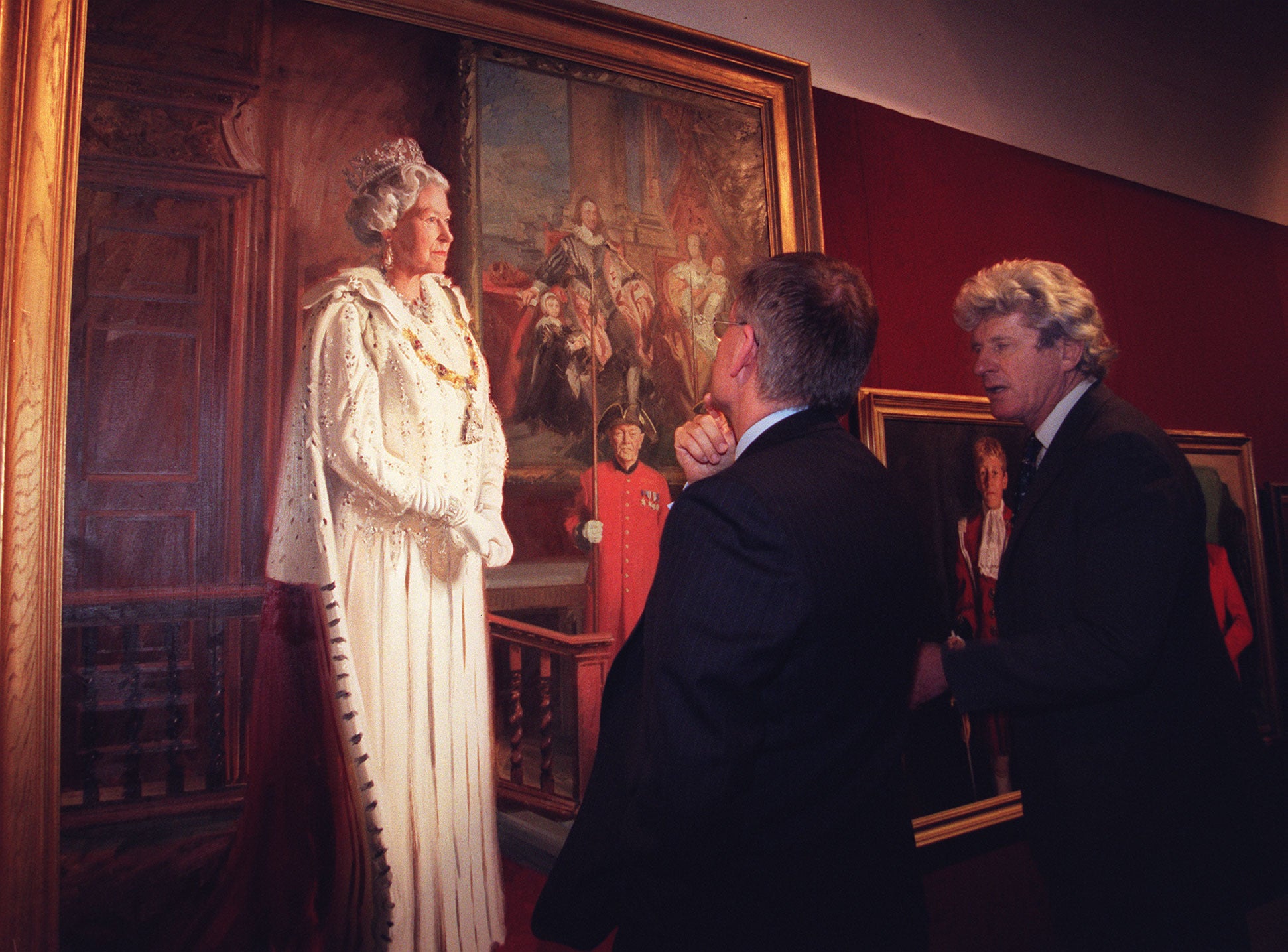 Artist Andrew Festing (right) and Conservative peer Lord Archer admire Festing's portrait of Her Majesty the Queen during a preview of the Royal Society of Portrait Painters 1999 exhibition in London