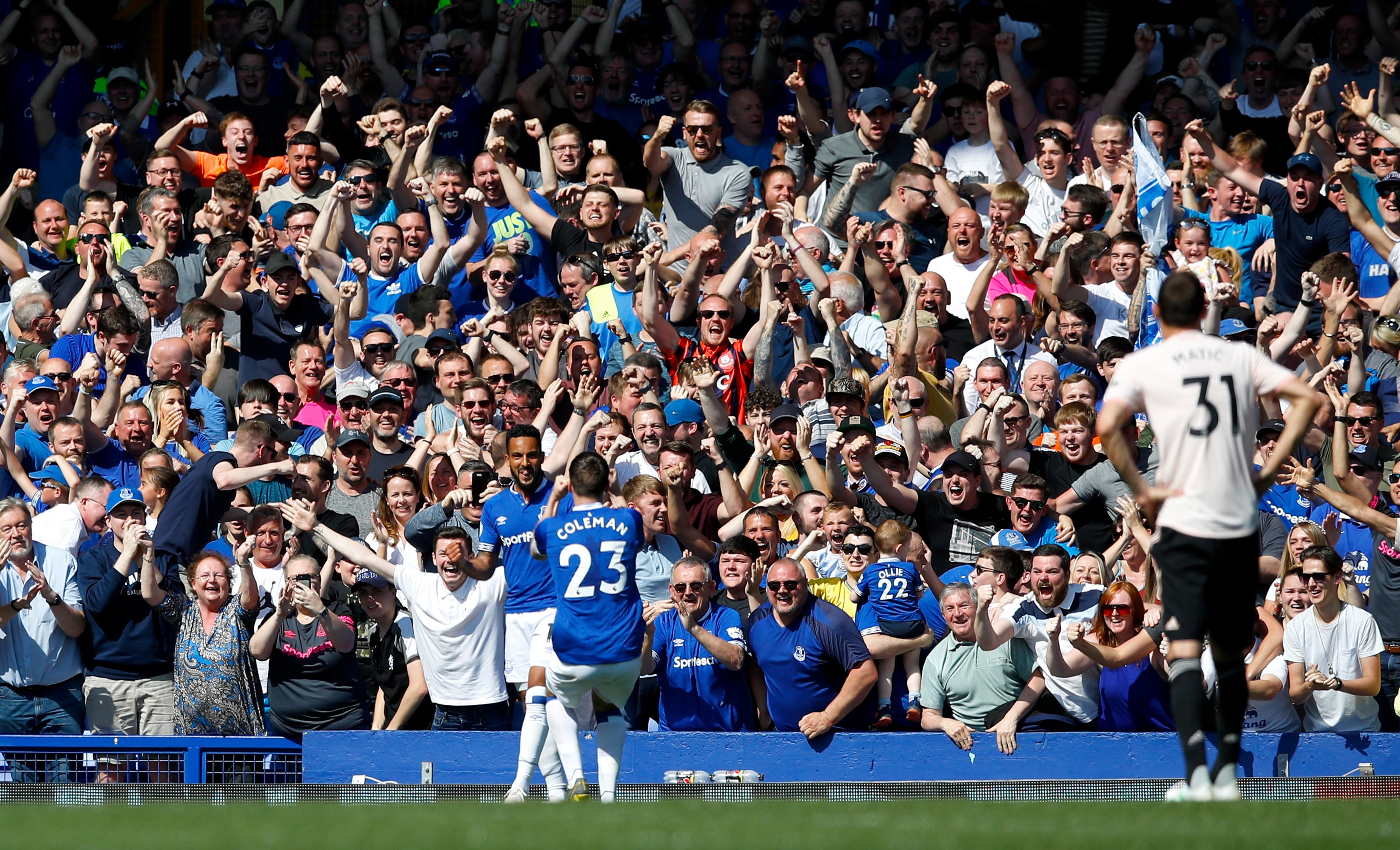 Theo Walcott (left) sends Goodison Park wild with a fourth goal against Manchester United in April 2019 (Martin Rickett/PA)