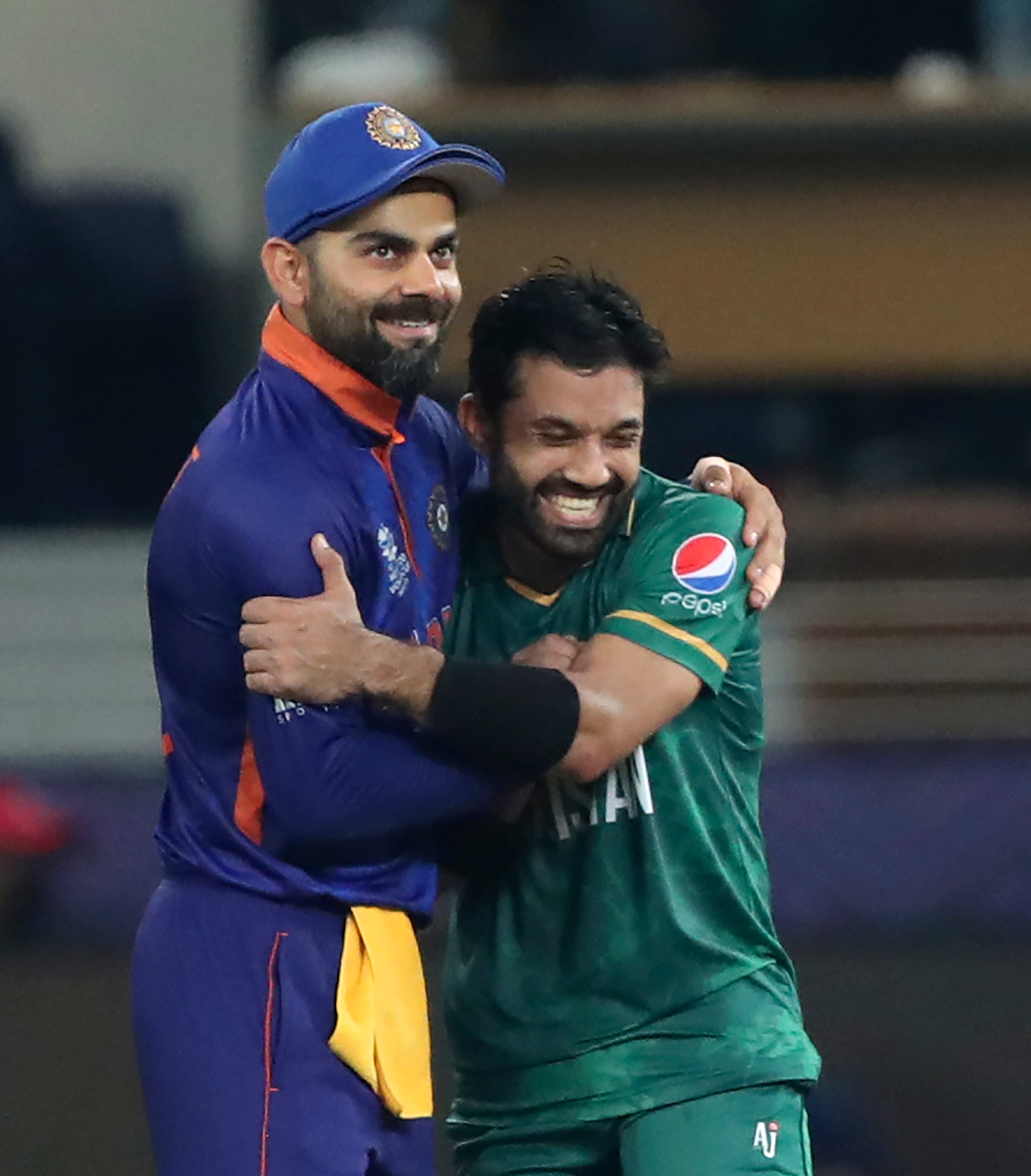 India captain Virat Kohli congratulates Pakistan batter Mohammad Rizwan (Aijaz Rahi/AP/PA)