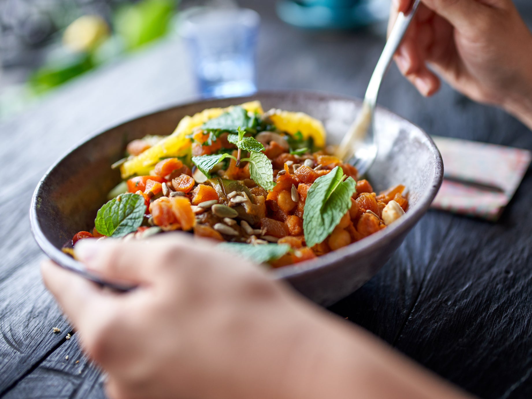 A person eats a vegetarian meal