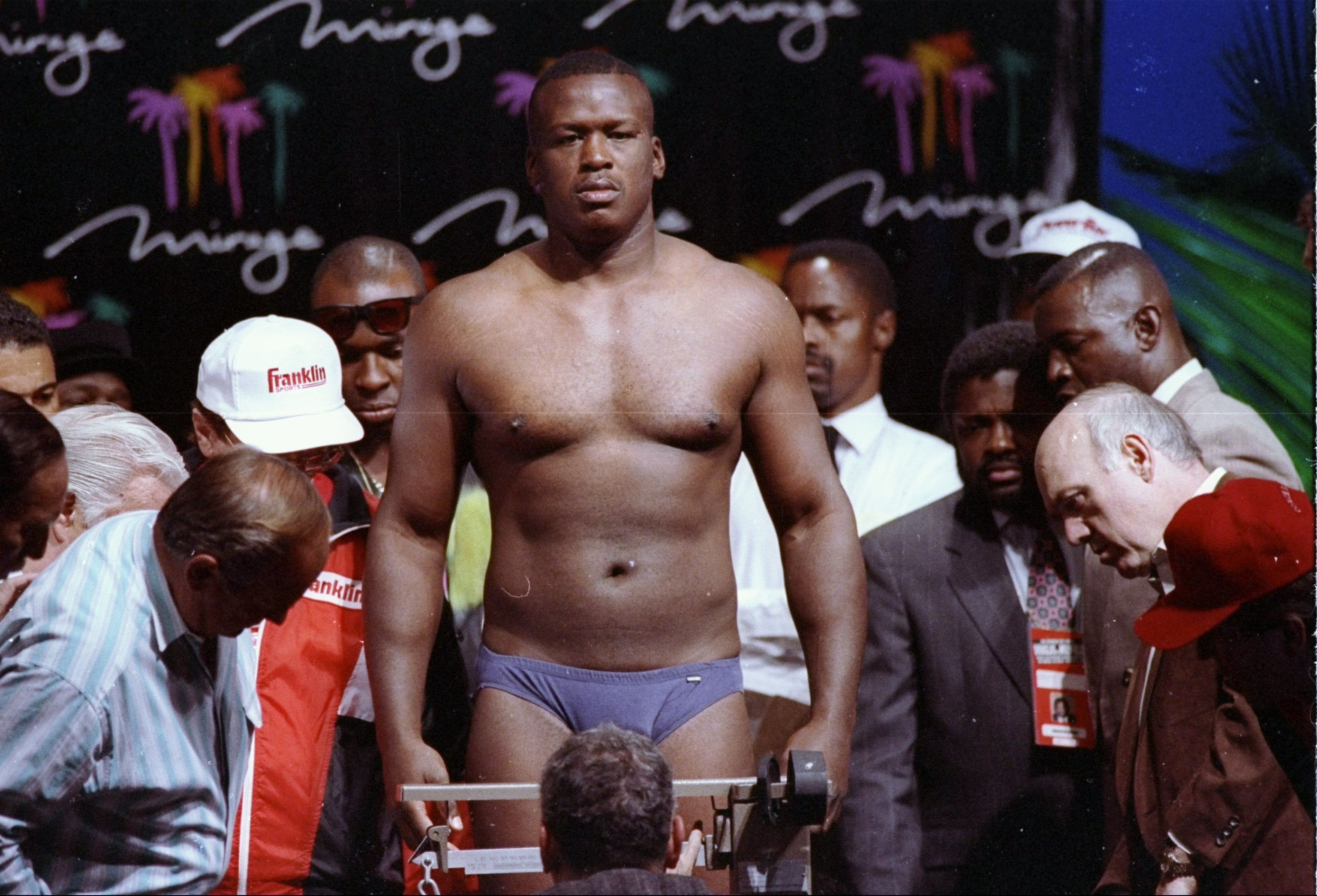 Douglas is weighed prior to his fight against Holyfield