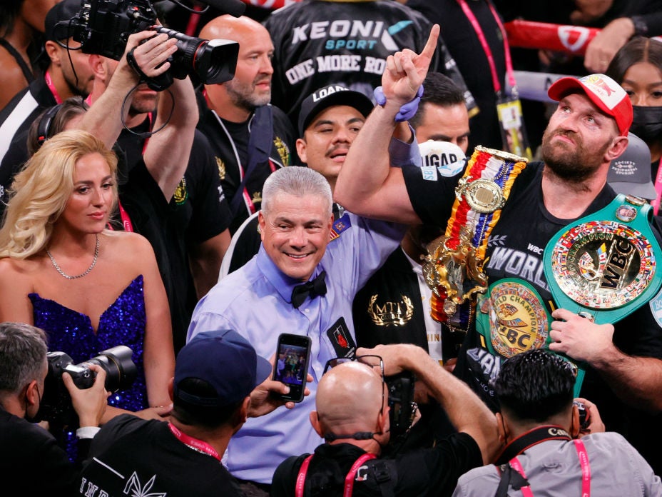 Paris (left) watched her husband Tyson (right) defeat Wilder for a second time in Las Vegas earlier this month