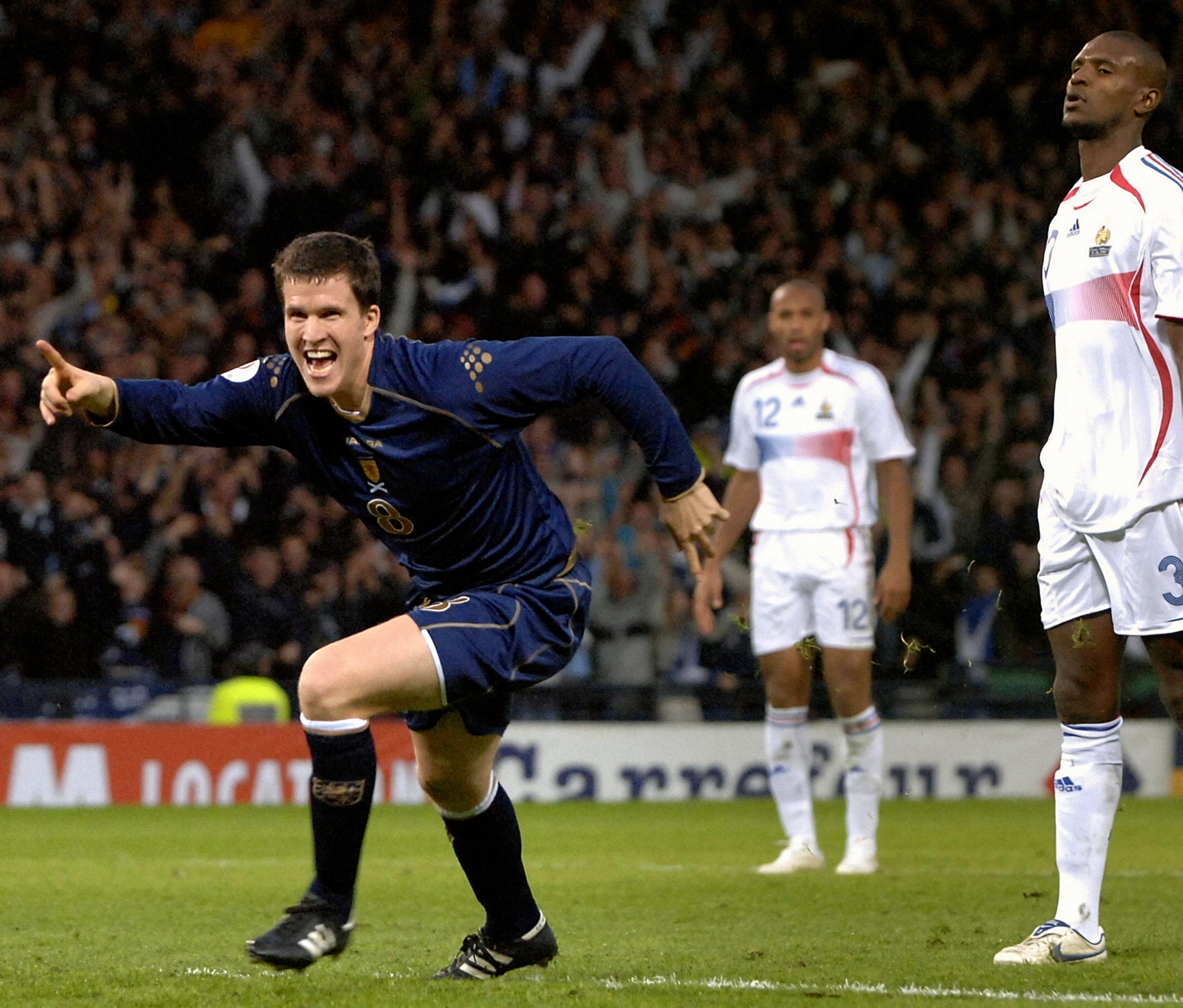 Gary Caldwell celebrates his winner against France (Chris Clark/PA)