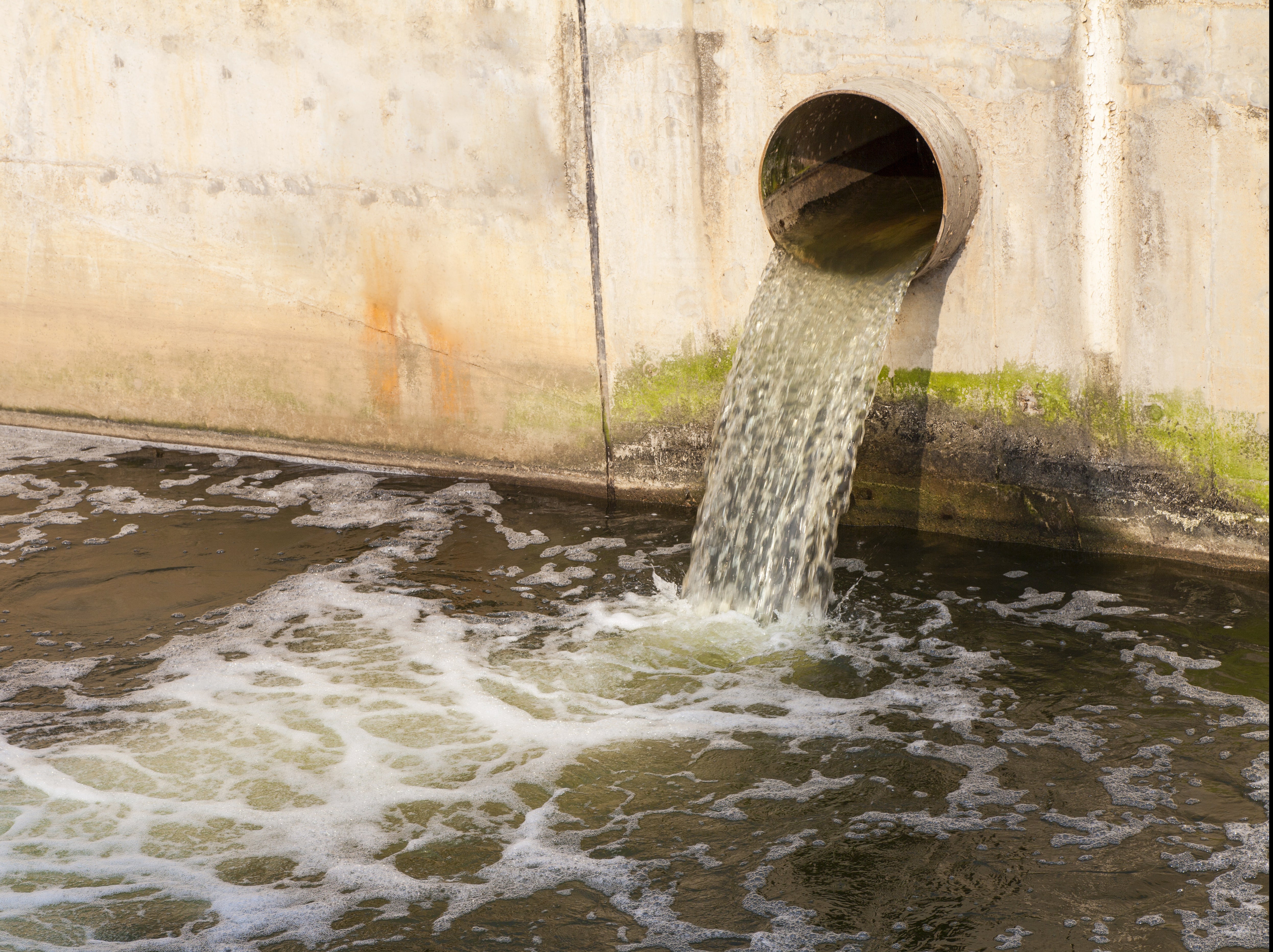 Dirty water being discharged into a river